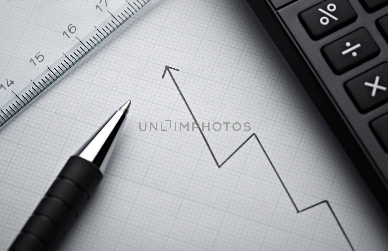 close up of a business finance graph, papers and pencil