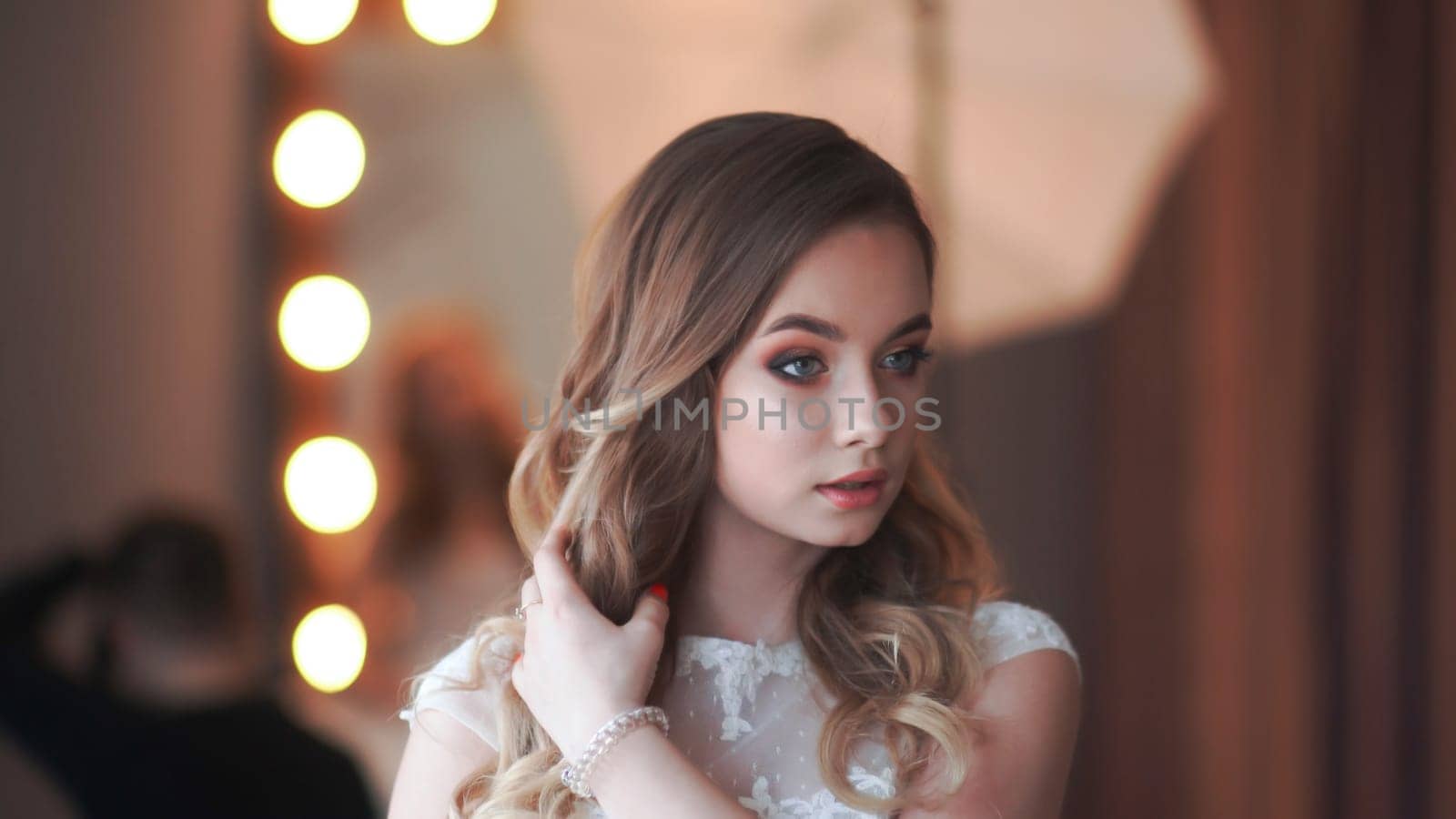 Beautiful girl model posing in front of a mirror