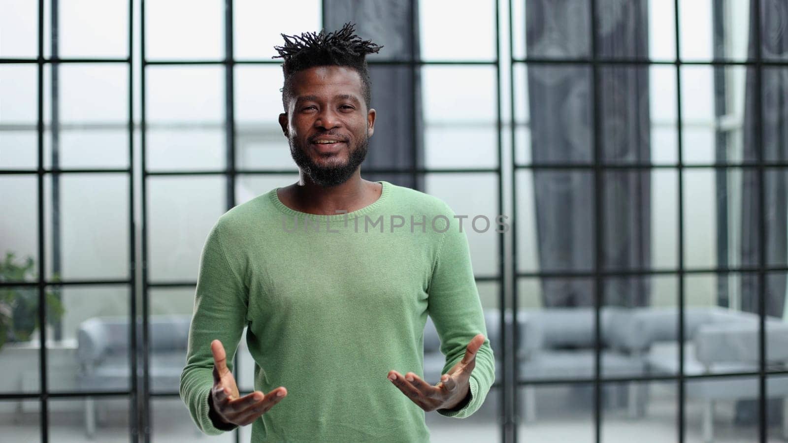 Portrait of a happy African American entrepreneur in office