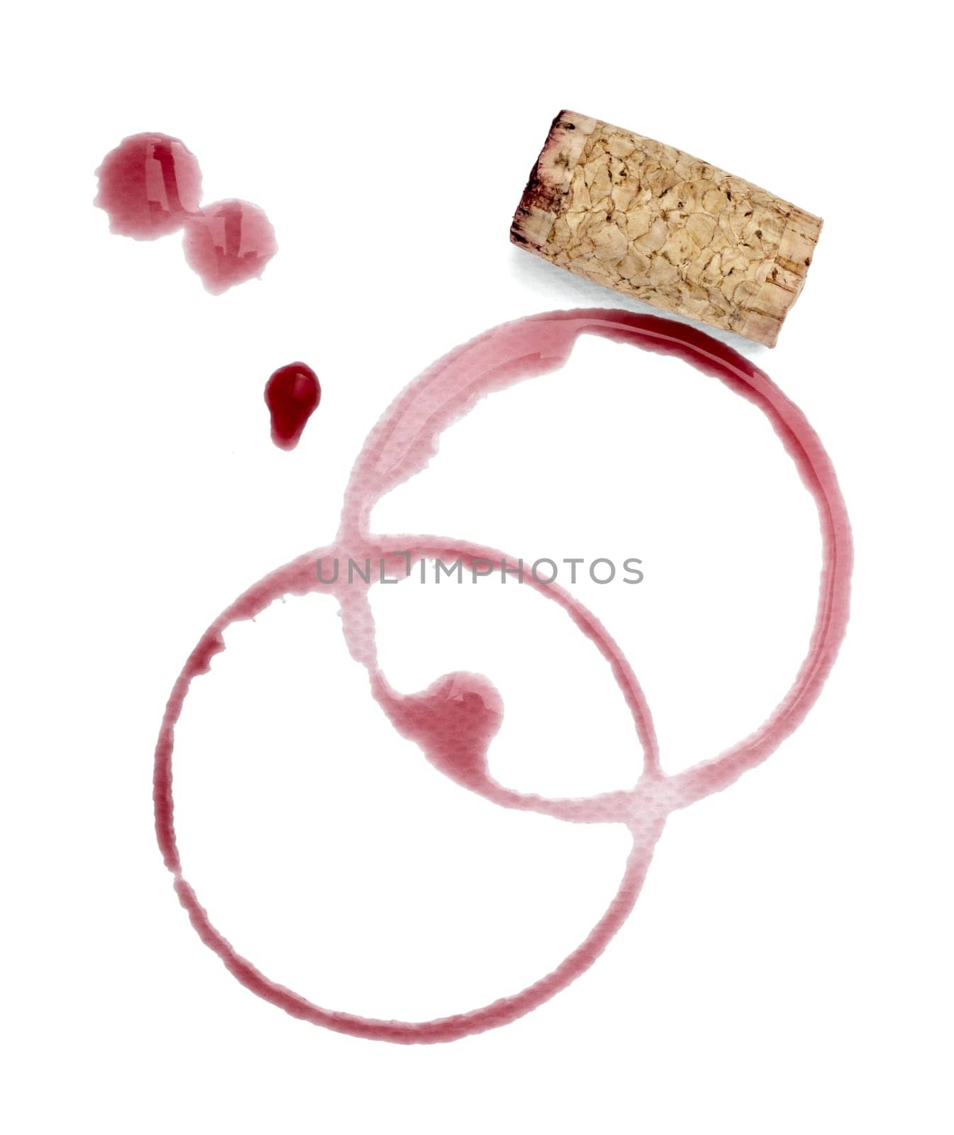 close up of a wine stain and corkscrew and cork cap on white background