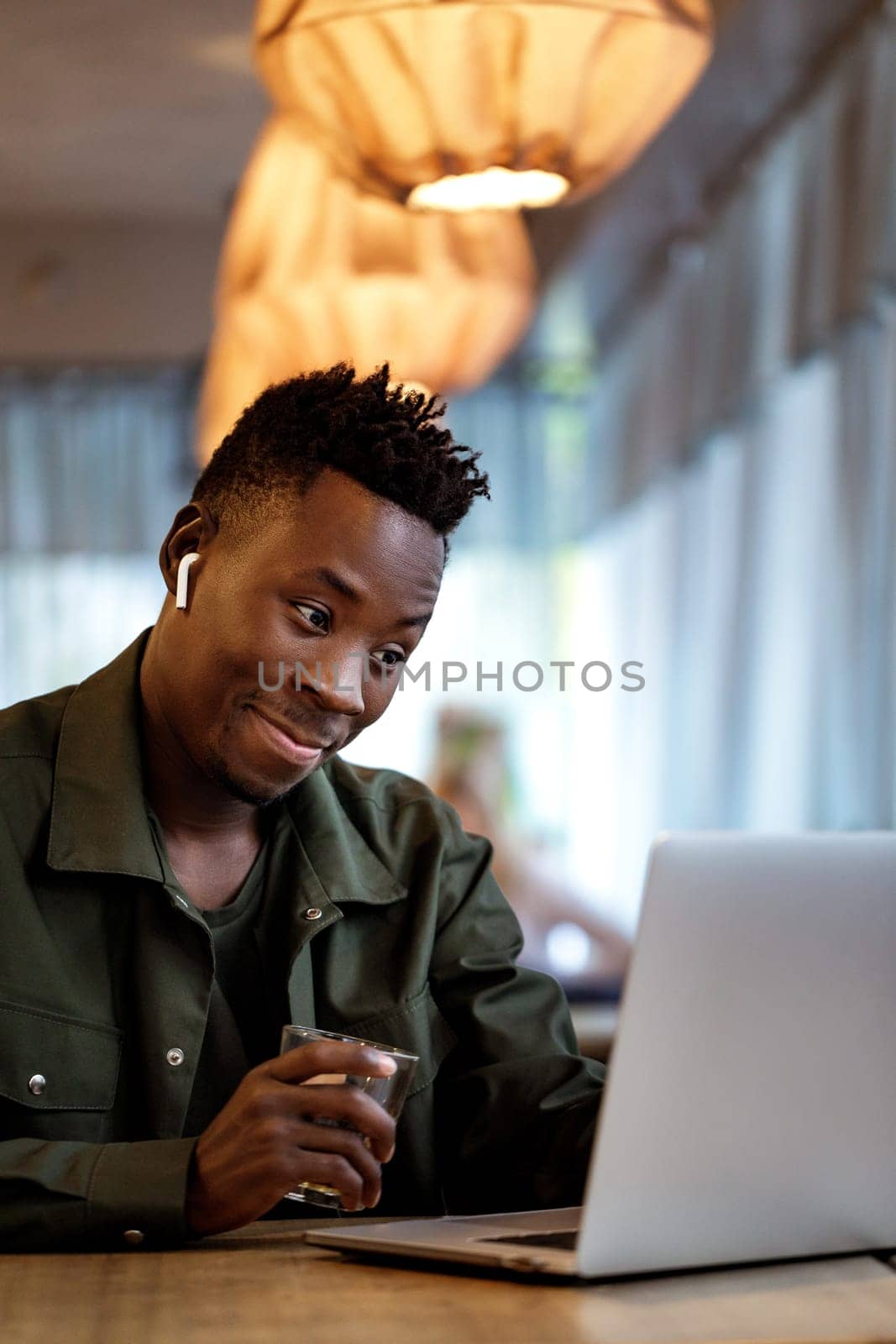 african american man using computer by erstudio