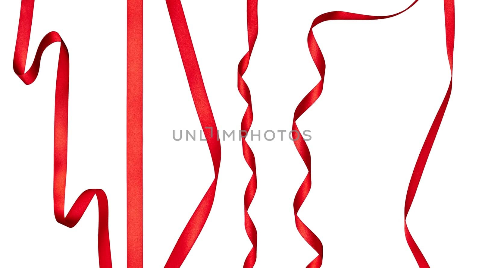 collection of various red ribbon pieces on white background. each one is shot separately