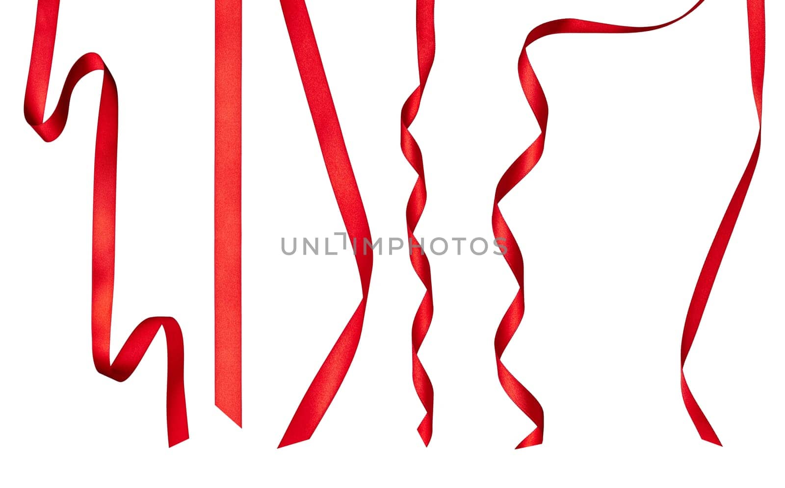 collection of various red ribbon pieces on white background. each one is shot separately