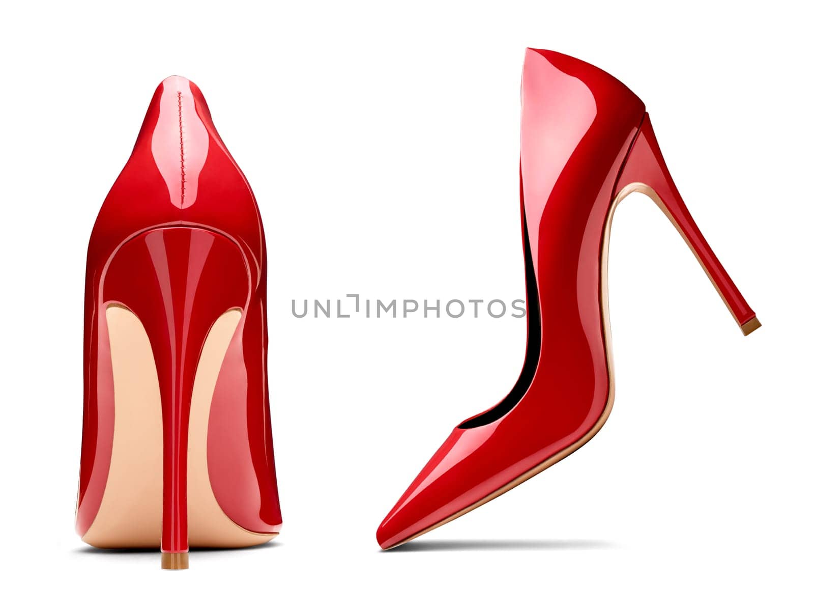 close up of red high heels on white background