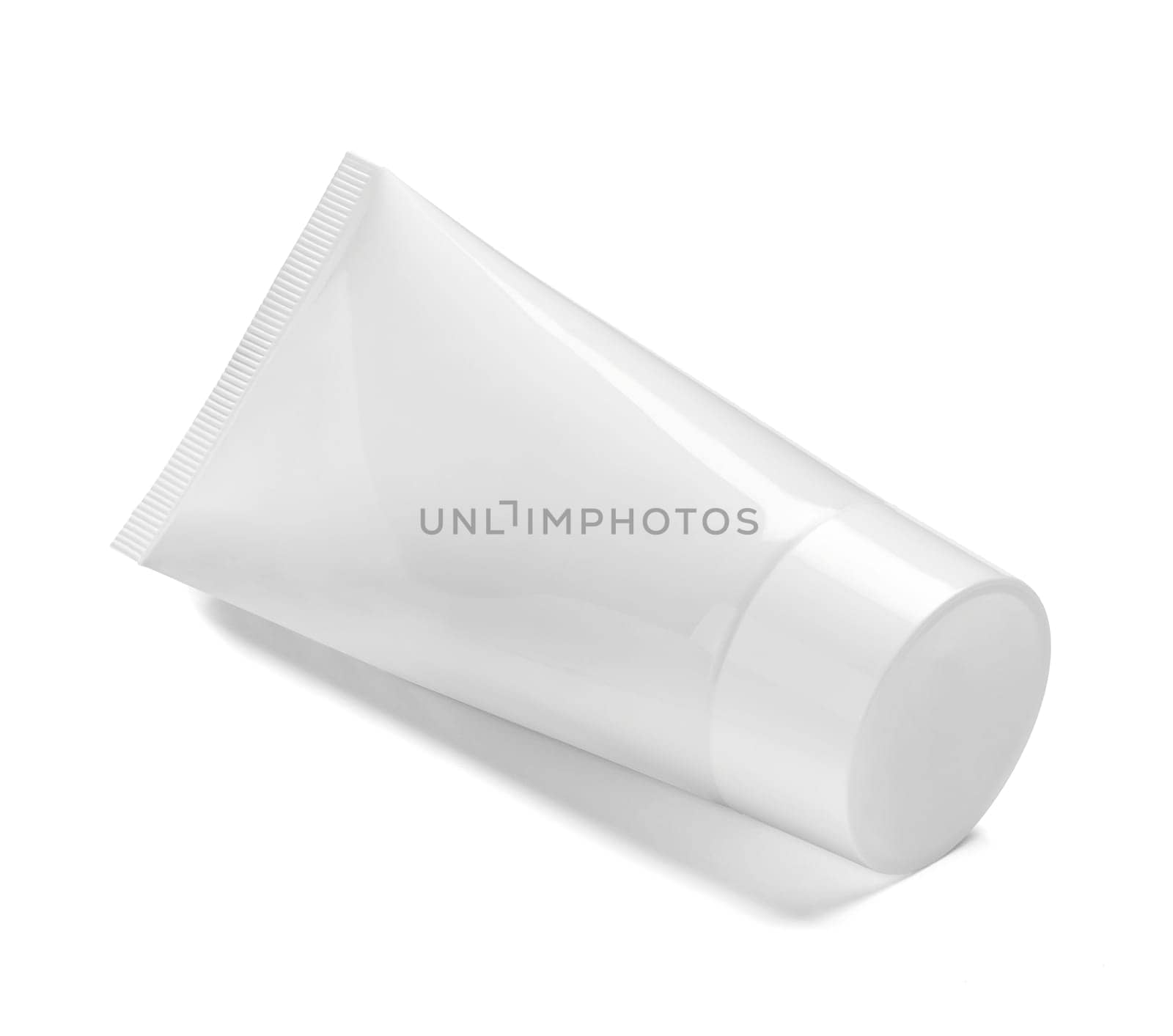 close up of a white beauty cream or a toothpaste tube on white background