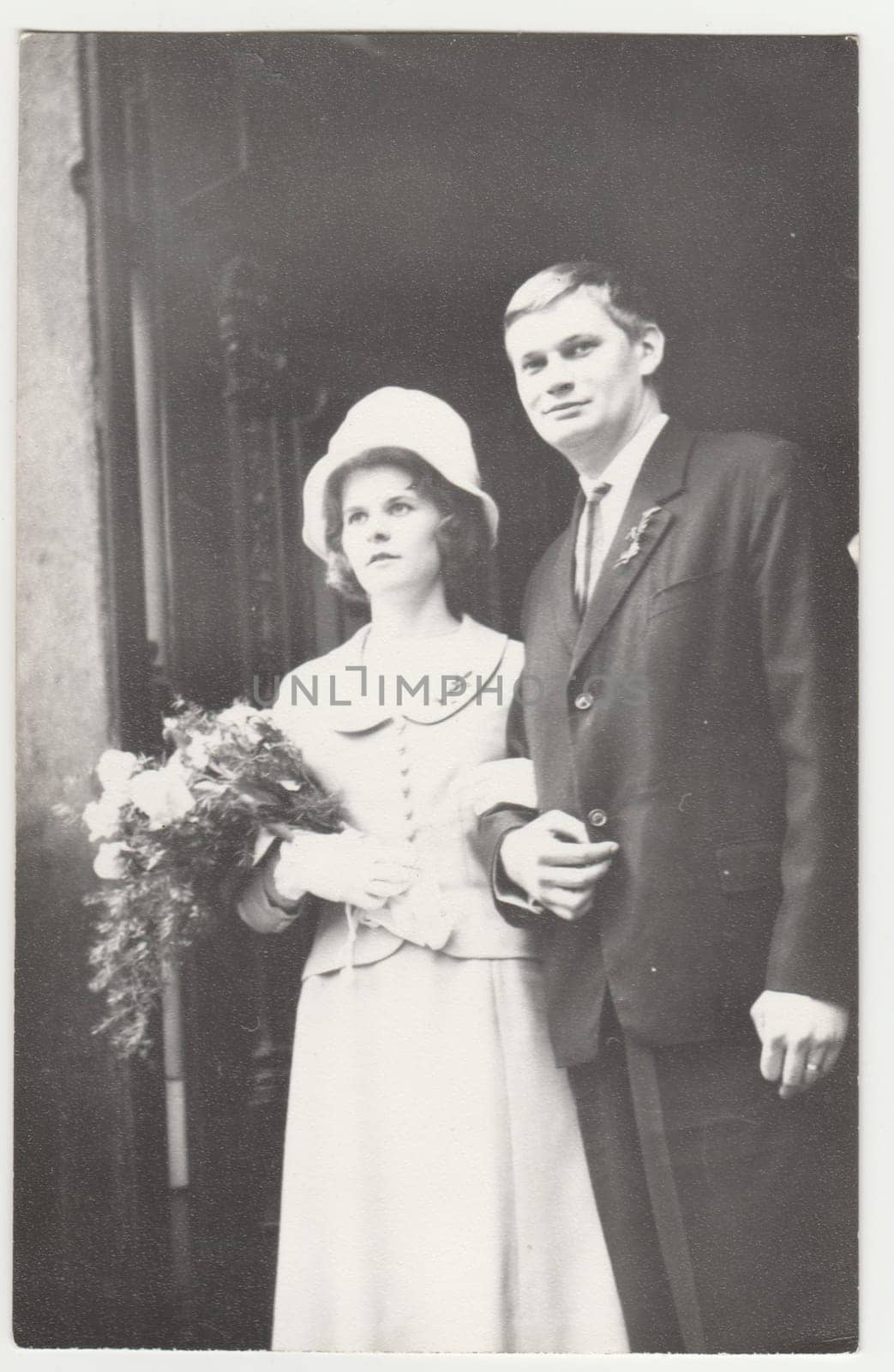 Vintage photo shows a newlyweds. Retro black and white photography. Circa 1970s. by roman_nerud