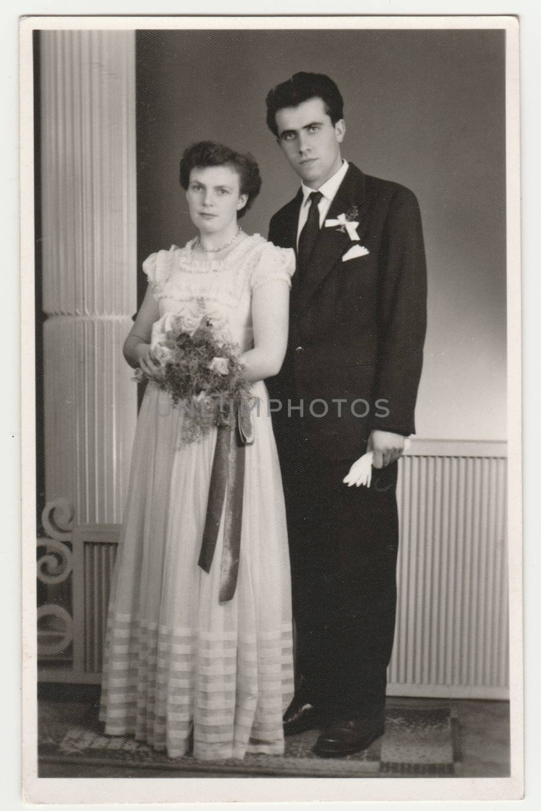 Vintage photo shows a newlyweds. Retro black and white photography. Circa 1970s. by roman_nerud