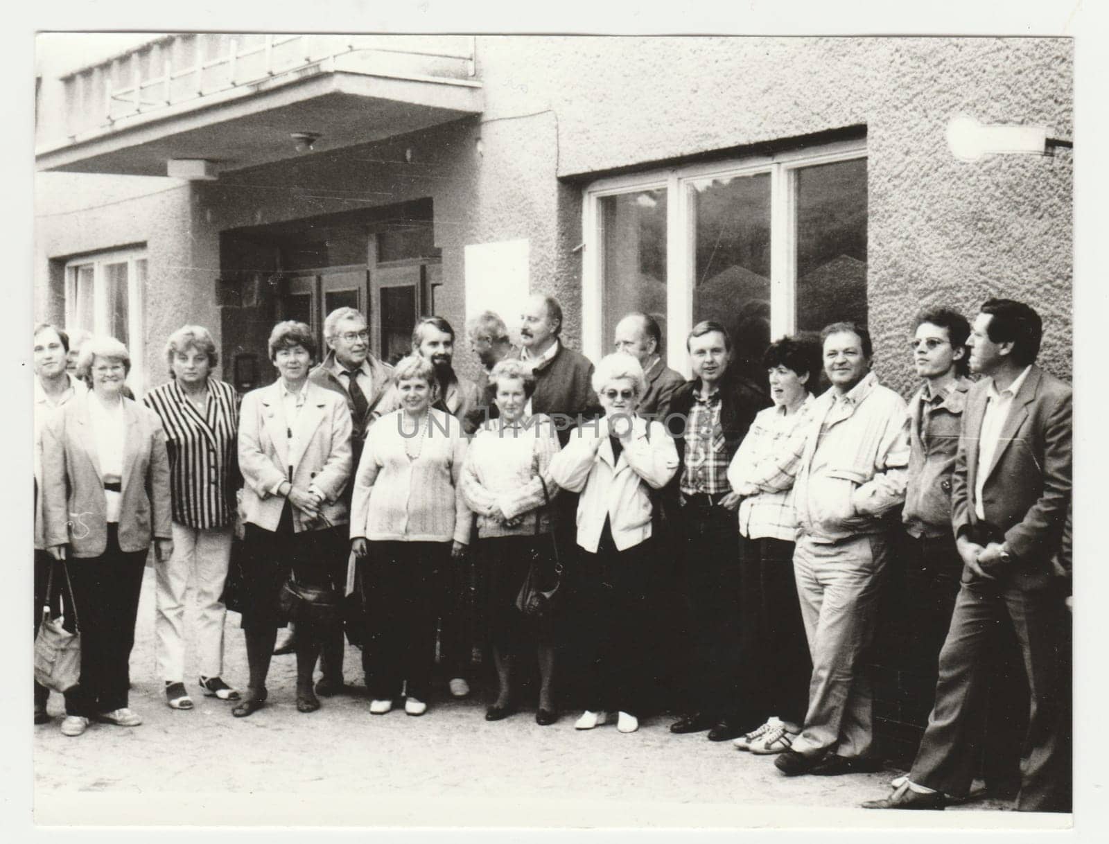 THE CZECHOSLOVAK SOCIALIST REPUBLIC - CIRCA 1980s: Vintage photo shows a group of people poses outdoors. Retro black and white photography. Circa 1980s.