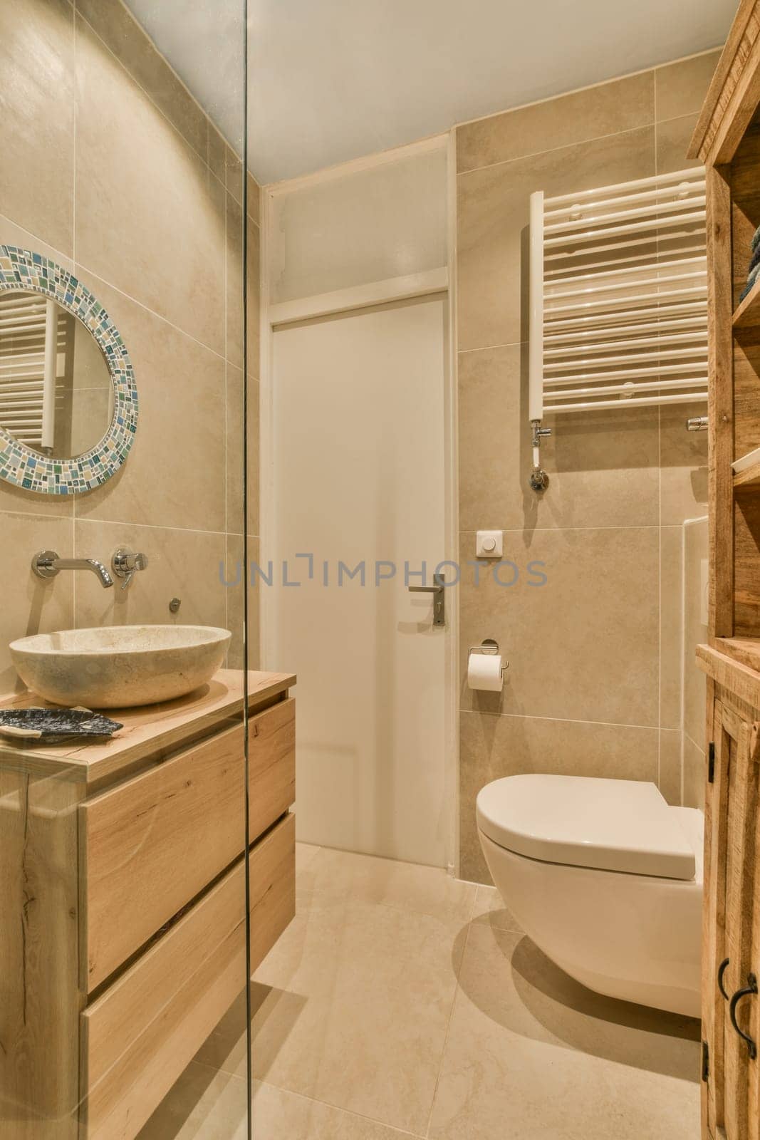 a bathroom with a toilet, sink and mirror on the wall next to it is a wooden cabinet that has been used for storage