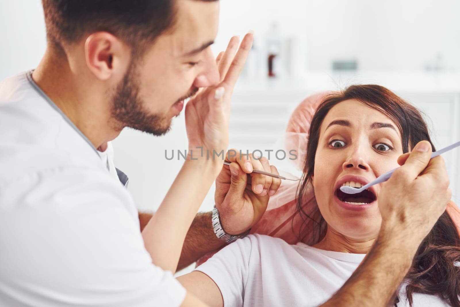 Woman visiting dentist in clinic. Conception of stomatology.