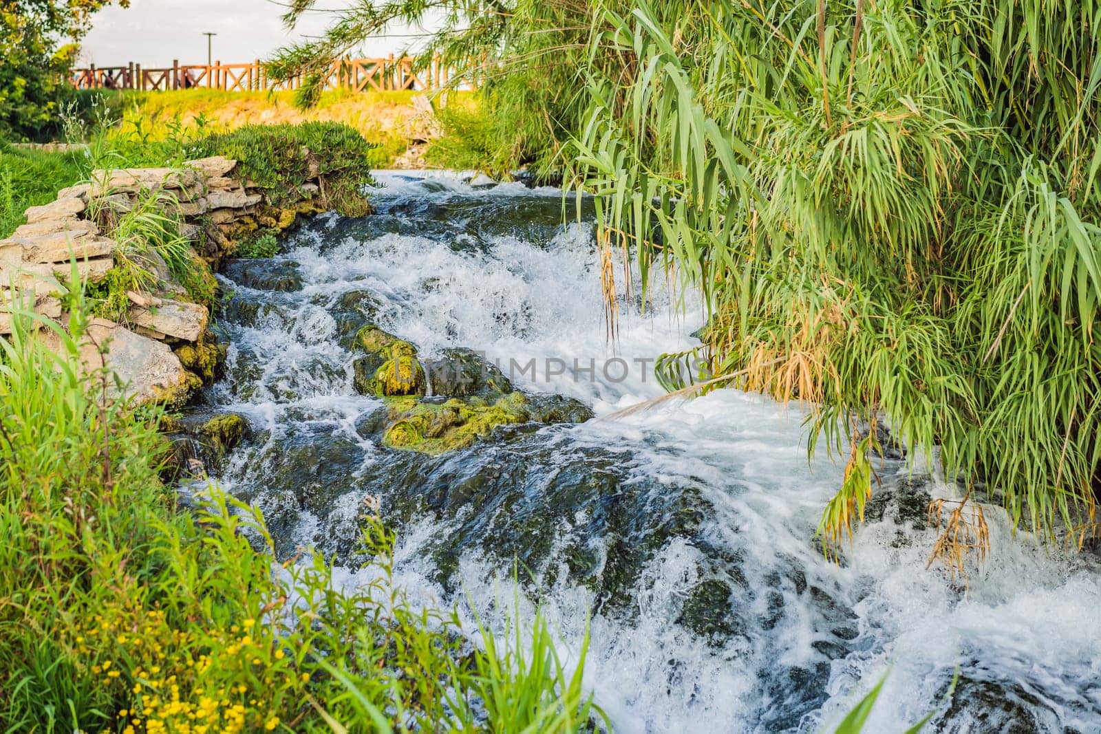 Lower Duden Falls drop off a rocky cliff falling from about 40 m into the Mediterranean Sea in amazing water clouds. Tourism and travel destination photo in Antalya, Turkey. Turkiye. by galitskaya