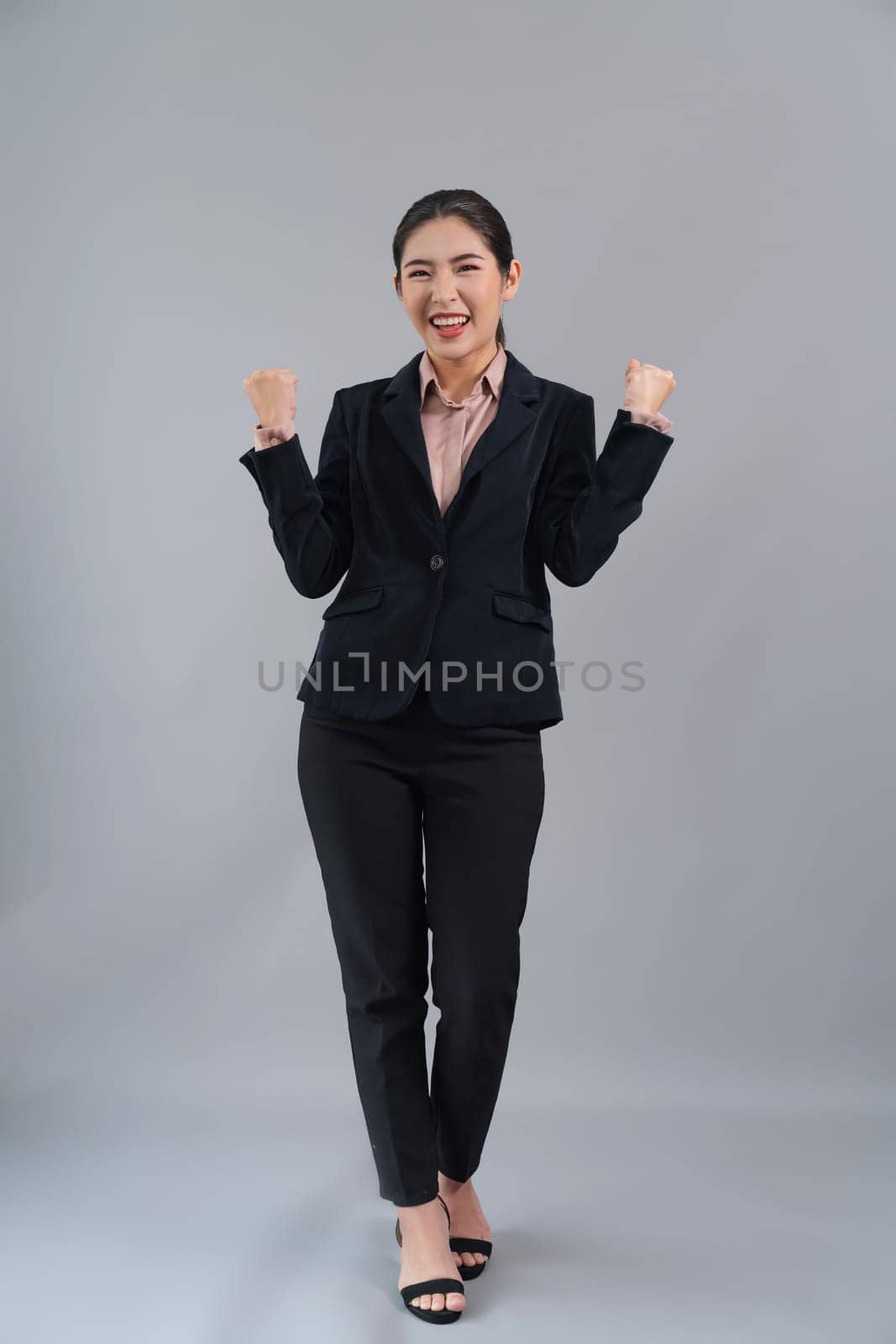 Confident young asian businesswoman making hand gesture. Enthusiastic by biancoblue