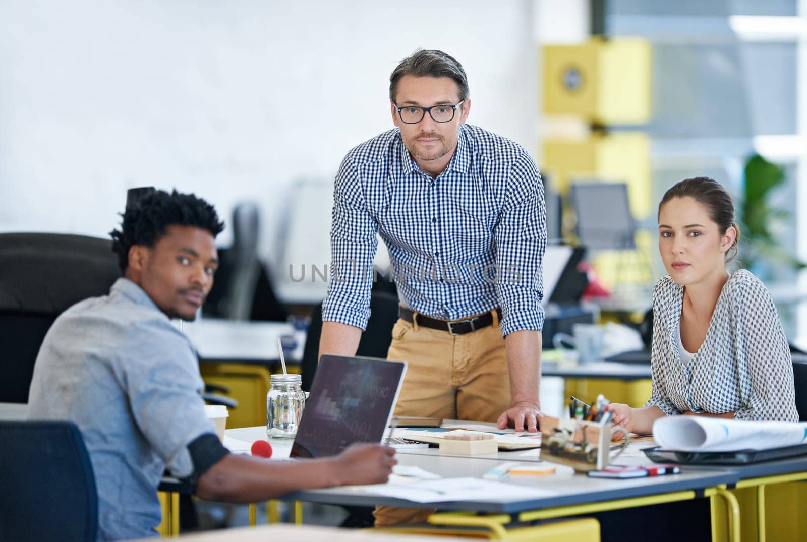 Their decisions ensure success. Portrait of a diverse group of designers working together in an office. by YuriArcurs