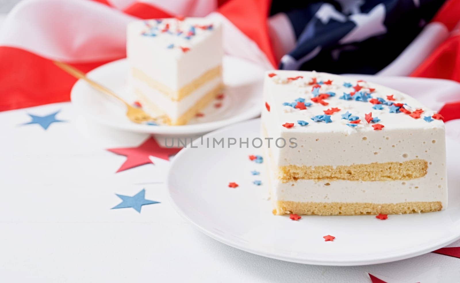 Fourth of july celebration. Sweet cake with usa flag colored sprinkles and stars , flag background