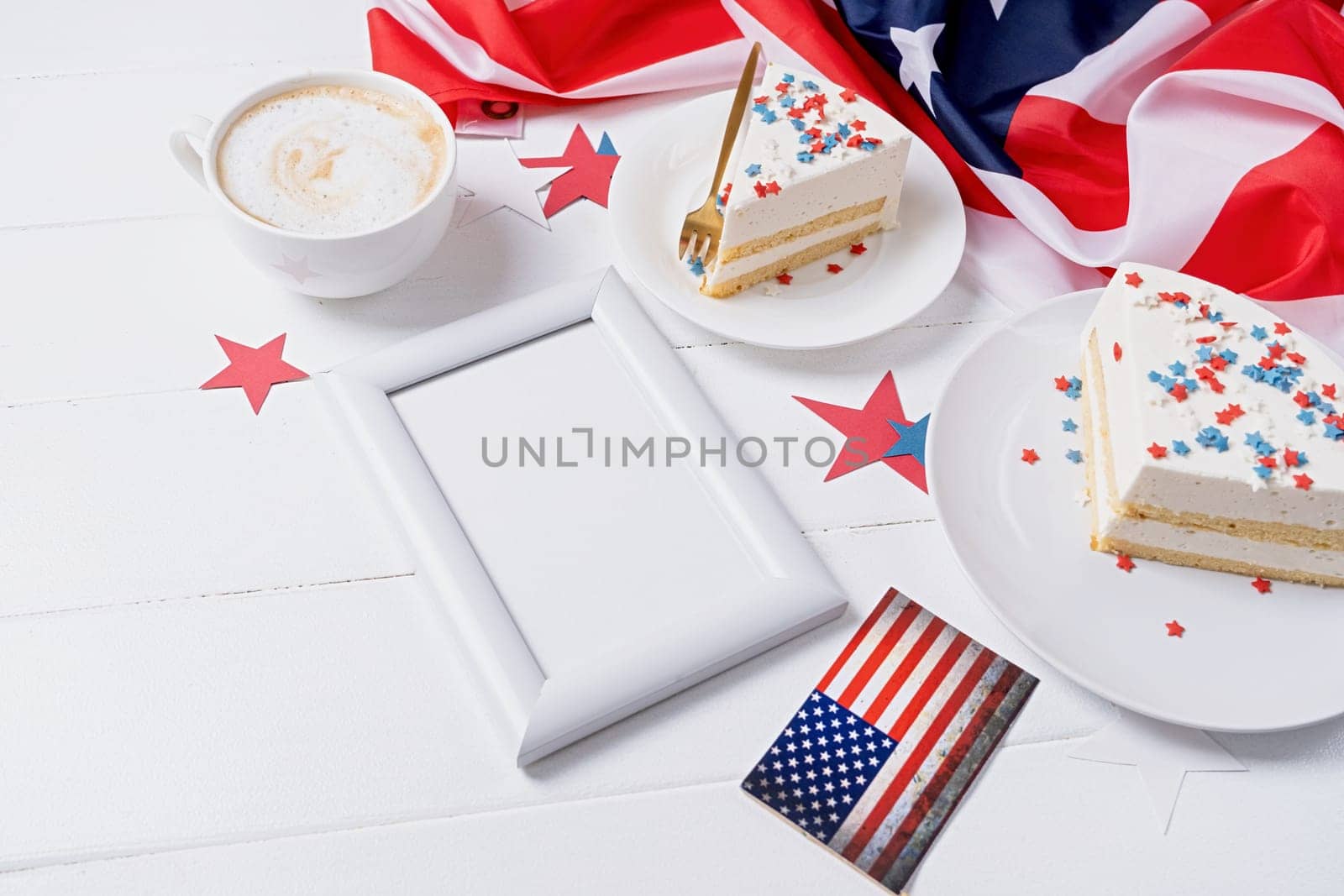 Fourth of july celebration. Sweet cake with usa flag colored sprinkles and stars and white framw for mockup design , flag background top view flat lay