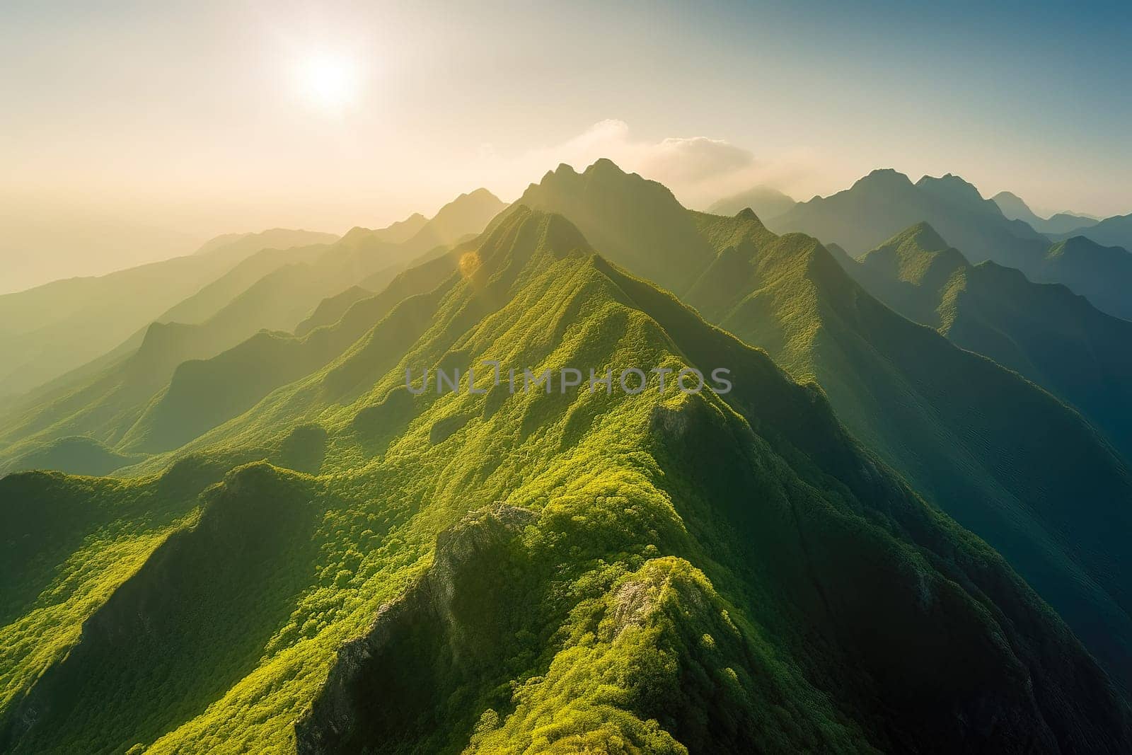 Beautiful sunrise over the green mountains in morning light with fluffy clouds on a bright blue sky. Nature freshness concept.