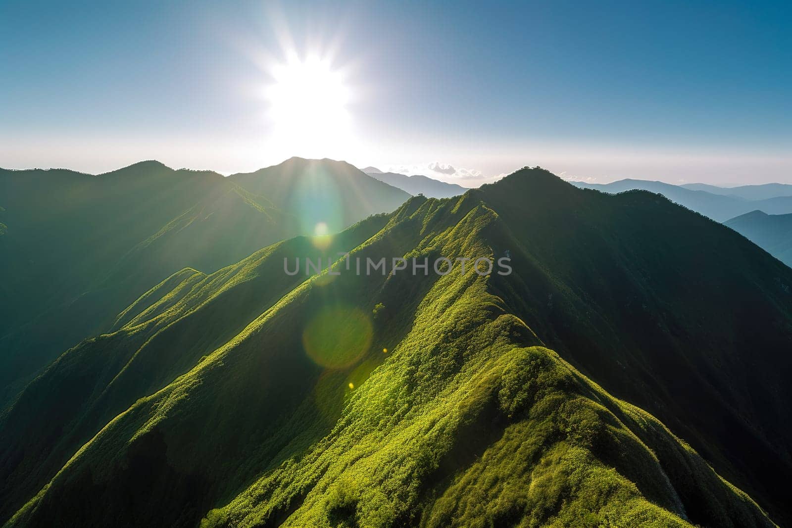 Beautiful sunrise over the green mountains in morning light with fluffy clouds on a bright blue sky. Nature freshness concept.