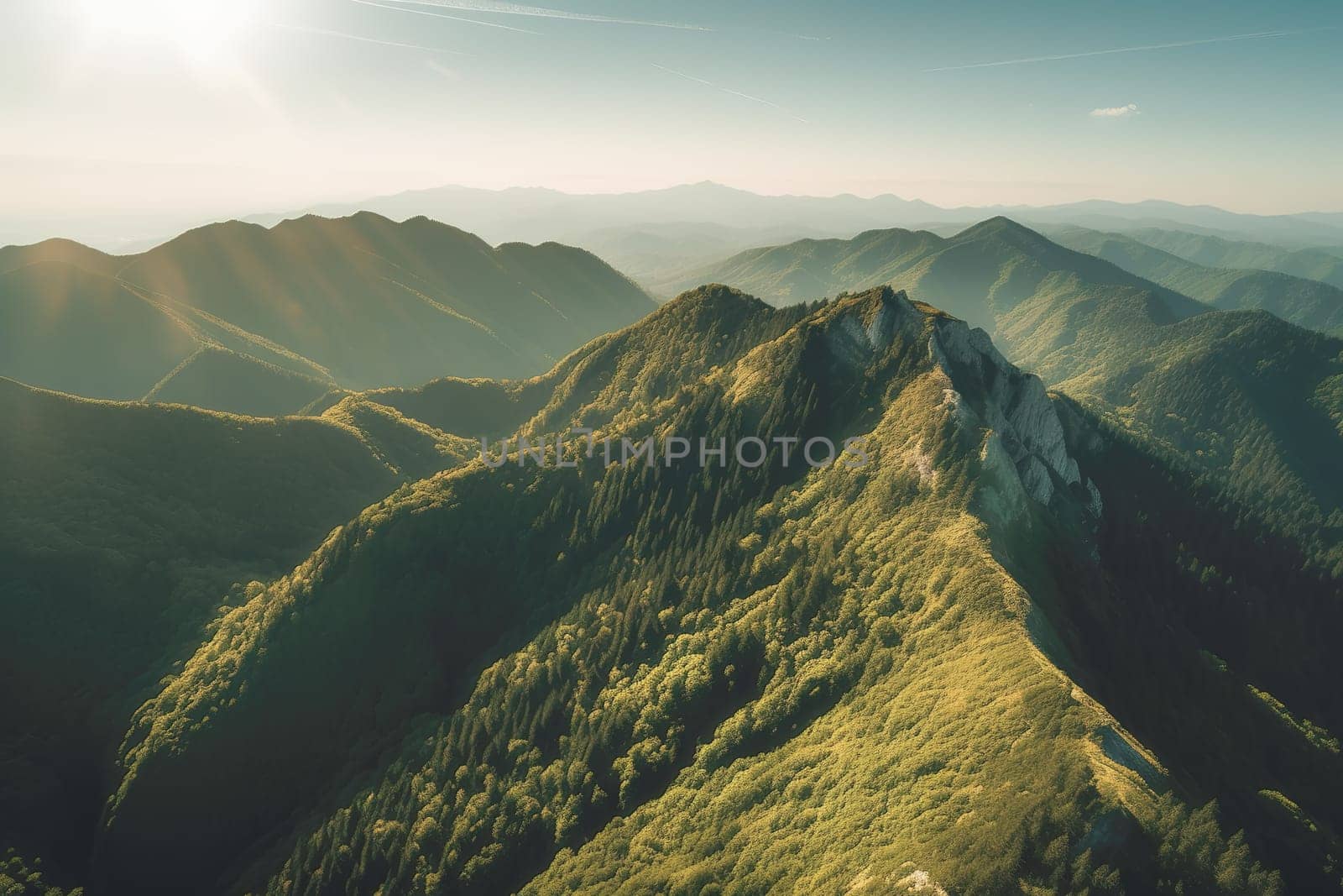 Beautiful sunrise over the green mountains in morning light with fluffy clouds on a bright blue sky. Nature freshness concept.