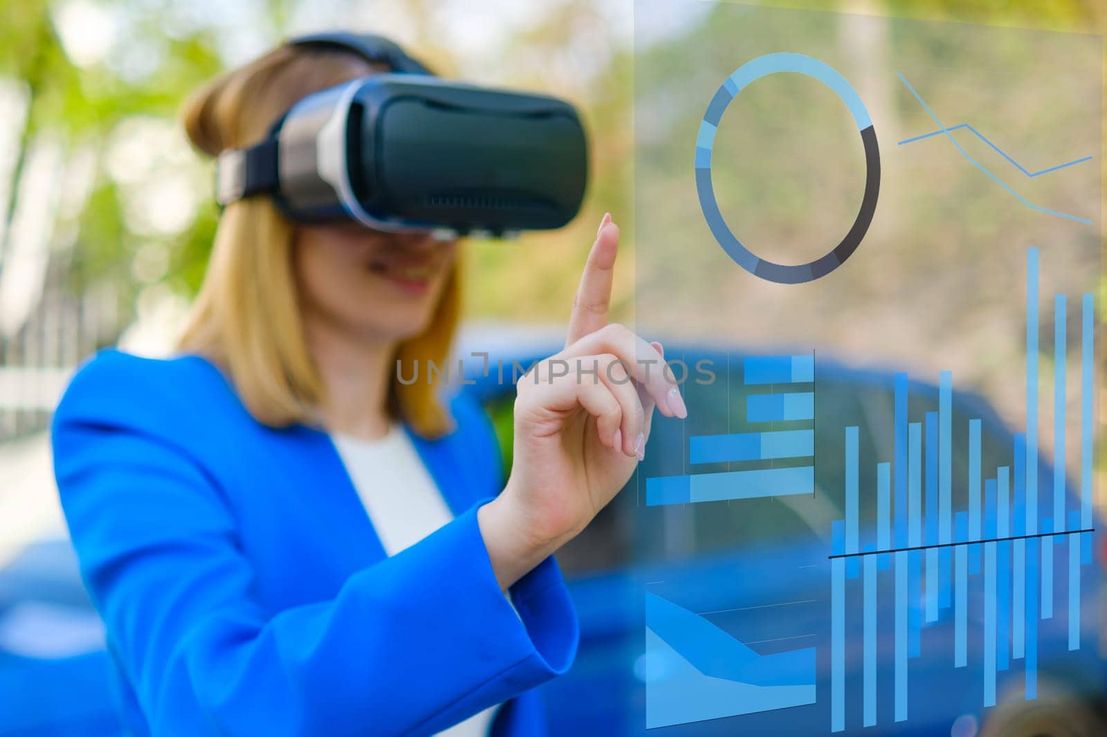 Attractive woman enjoying virtual reality glasses and managing the graphics in augmented reality.