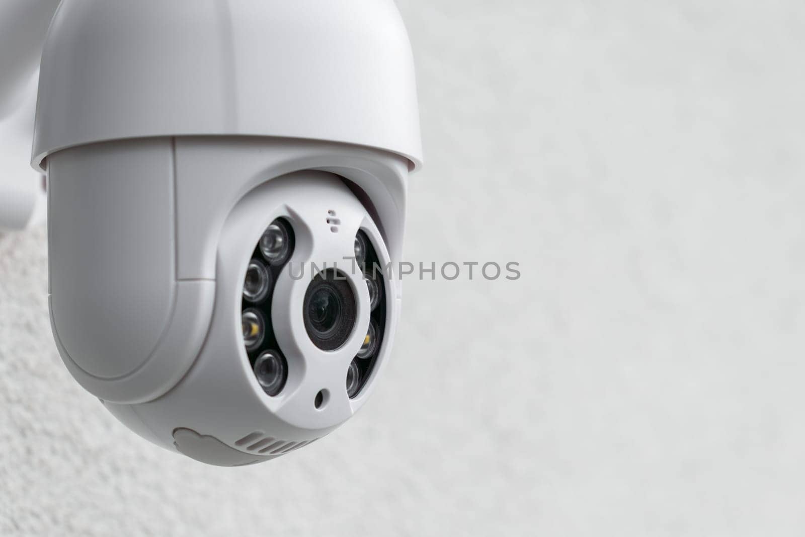 Security CCTV camera in office or shop building for protection against thieves, close up with copy space