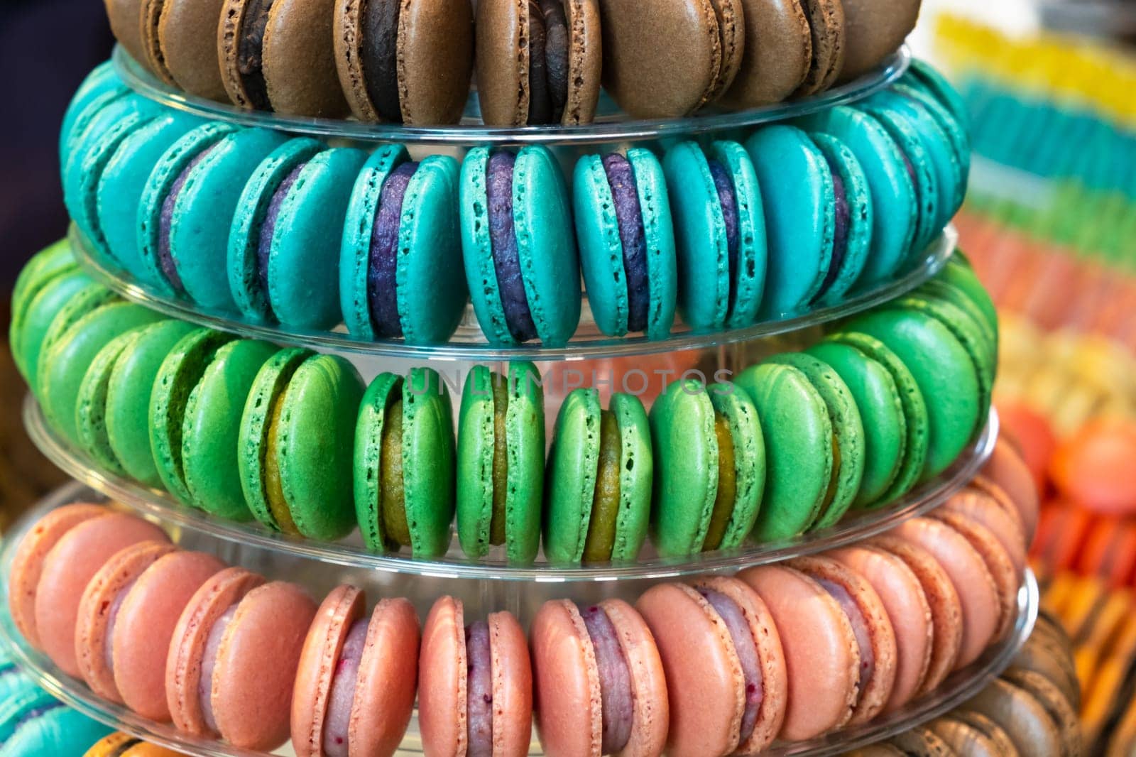 Colorful delicious French macarons pyramid for the candy bar for wedding or happy birthday party, st Valentines day, 8 march, international women day, Mother Day.