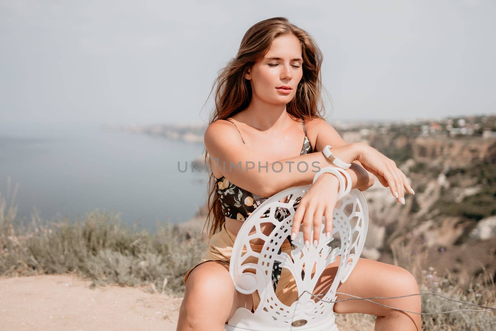 Happy boho woman portrait. Boho chic fashion style. Outdoor photo of free happy woman with long hair, sunny weather outdoors with sea mountains nature beautiful background. by panophotograph