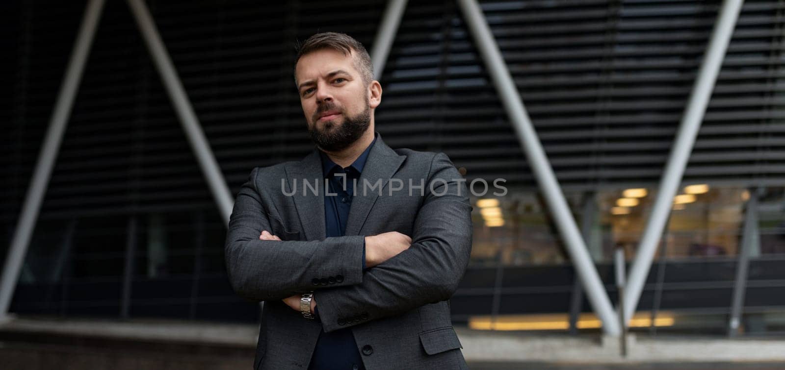 business portrait of a male businessman on the background of a modern business center.
