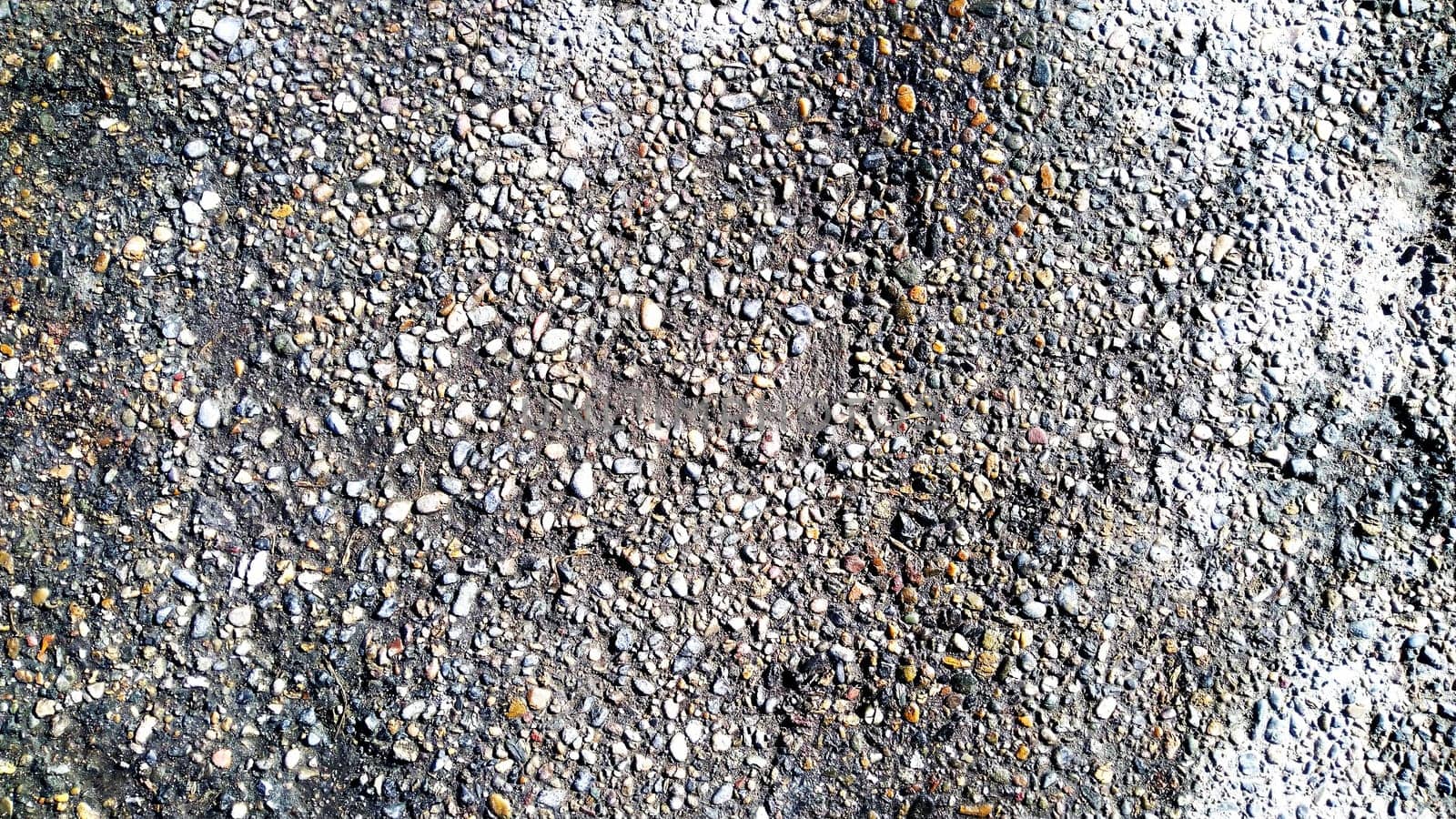 the old asphalt is gray, black in color, the texture is made of asphalt. Gray texture of the road covered with asphalt