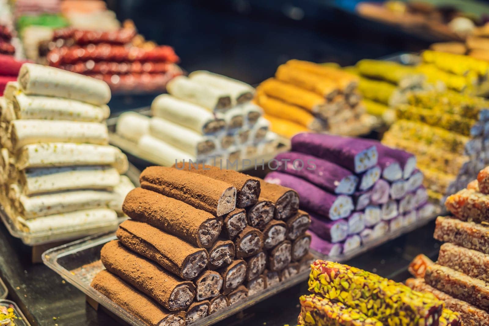 Traditional oriental sweet pastry cookies, nuts, dried fruits, pastilles, marmalade, Turkish desert with sugar, honey and pistachio, in display at a street food market by galitskaya