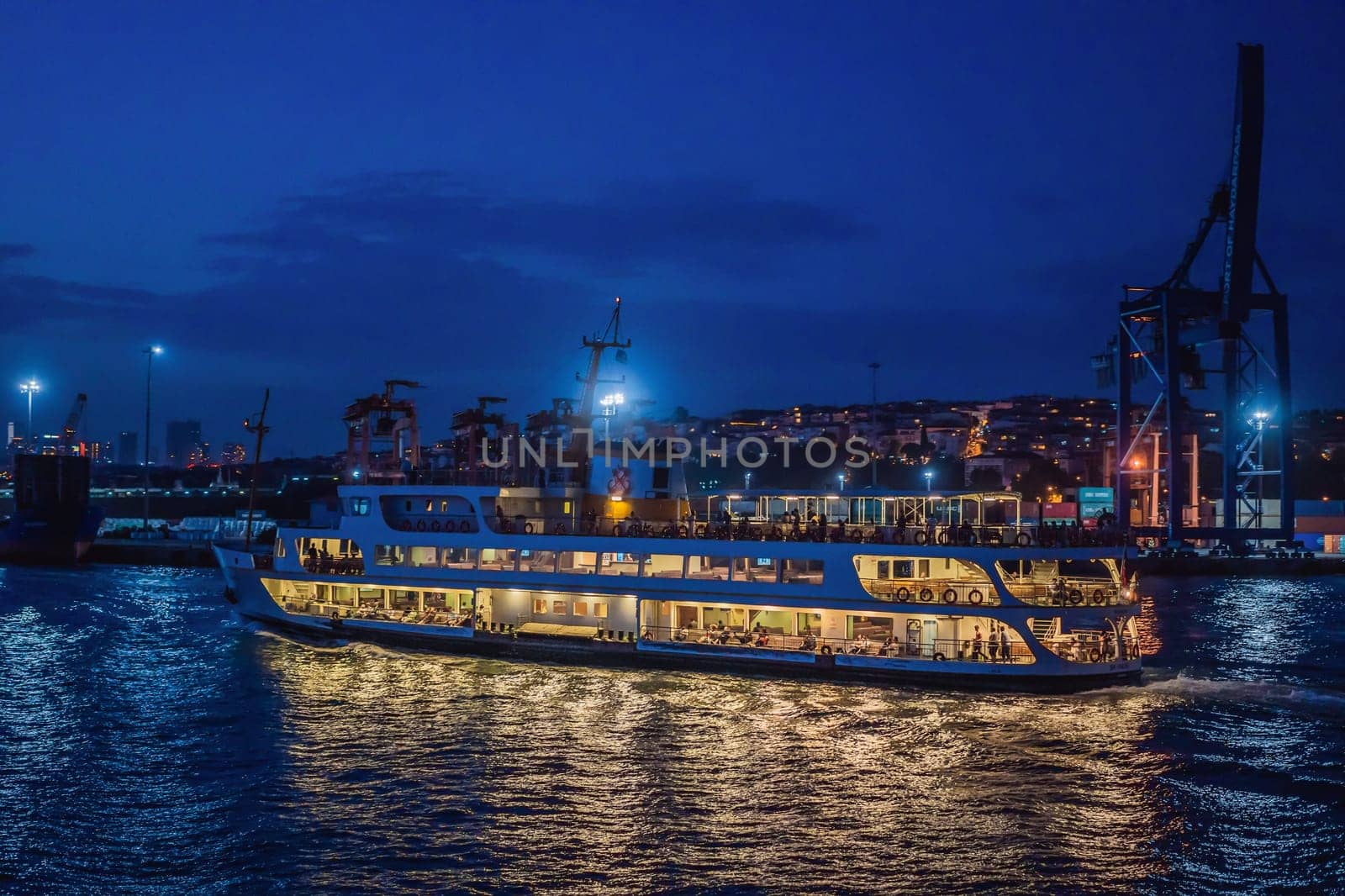 Istanbul, Turkey August 13, 2022: Muslim architecture and water transport in Turkey - Beautiful View touristic landmarks from sea voyage on Bosphorus.