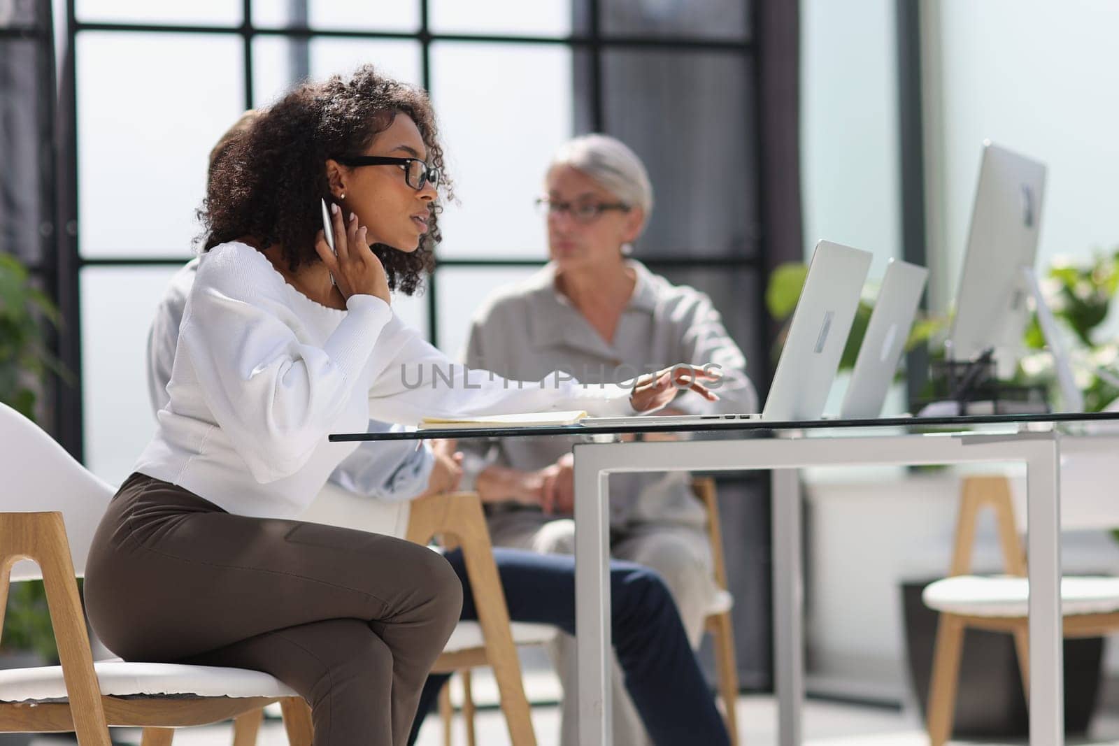 young attractive african american woman in the office by Prosto