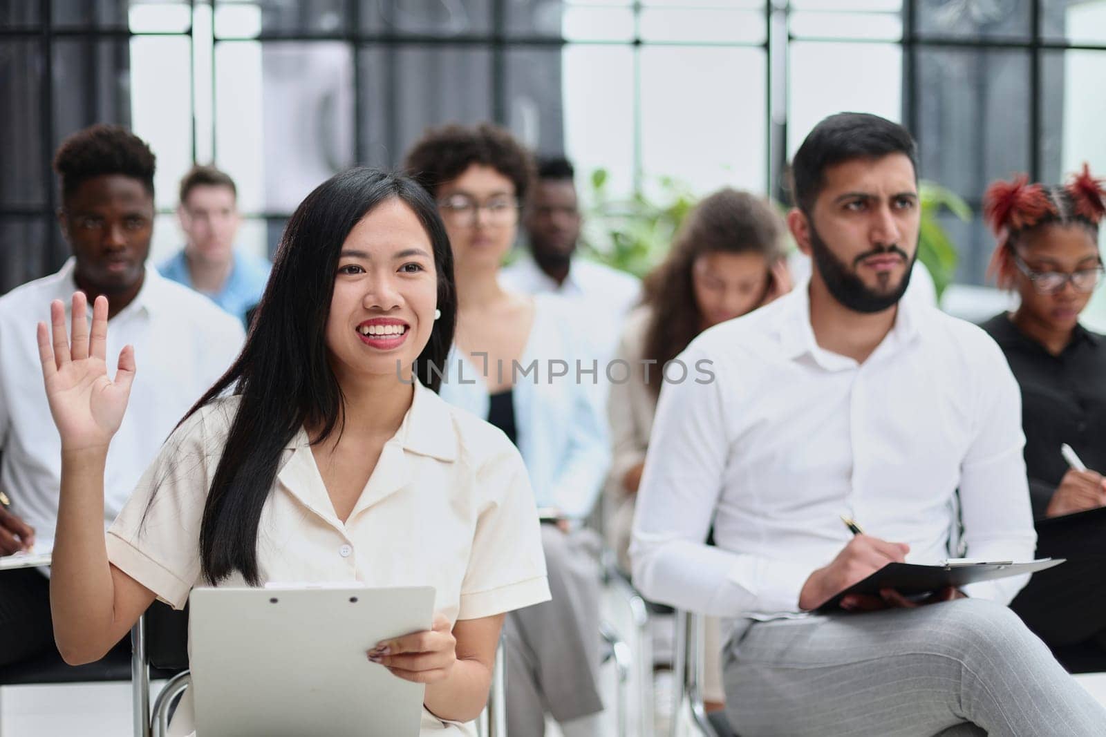 conducts business training with a group of young people.