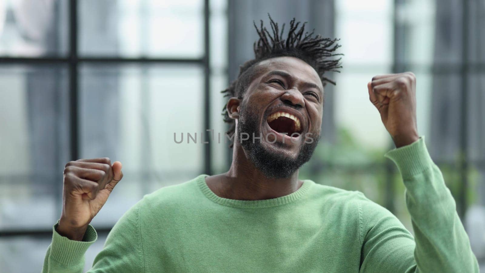 Happy Excited Young Man With Arms Up