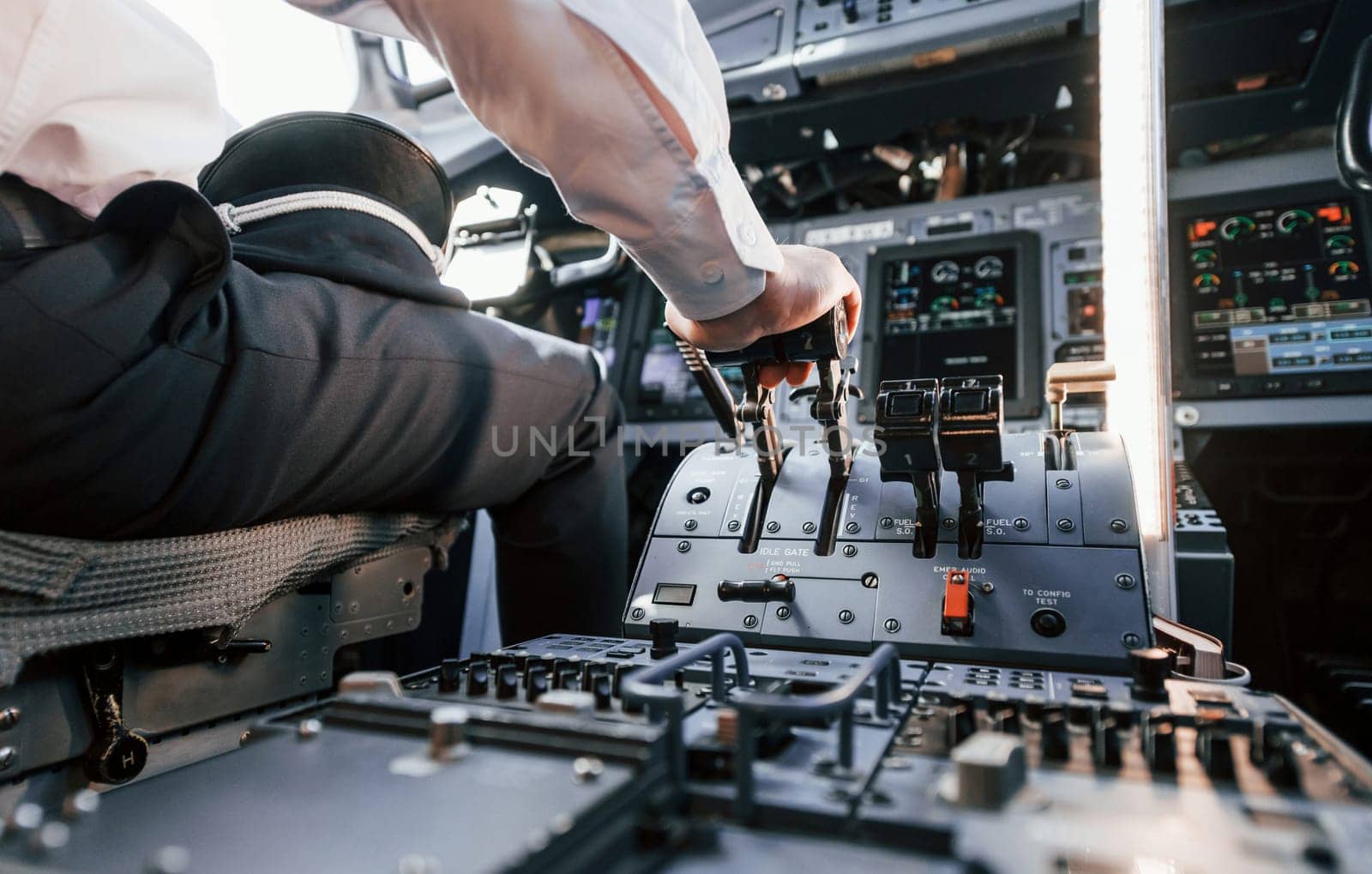 Control of the flight. Pilot on the work in the passenger airplane. Preparing for takeoff.