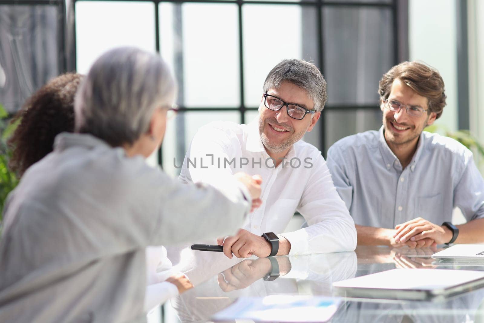 discussion of business people in the office sitting at the table