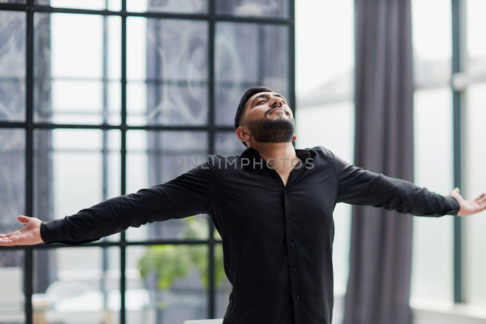 Achievement career wealth business concept. Mock up copy space. Clenching fists like winner.