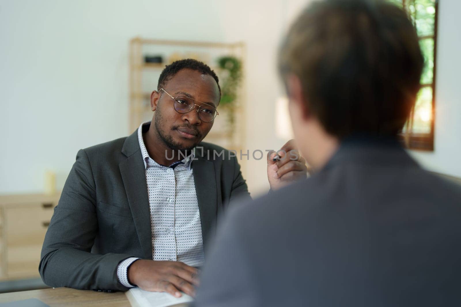 african american attorney, lawyers discussing contract or business agreement at law firm office, Business people making deal document legal, justice advice service concepts.