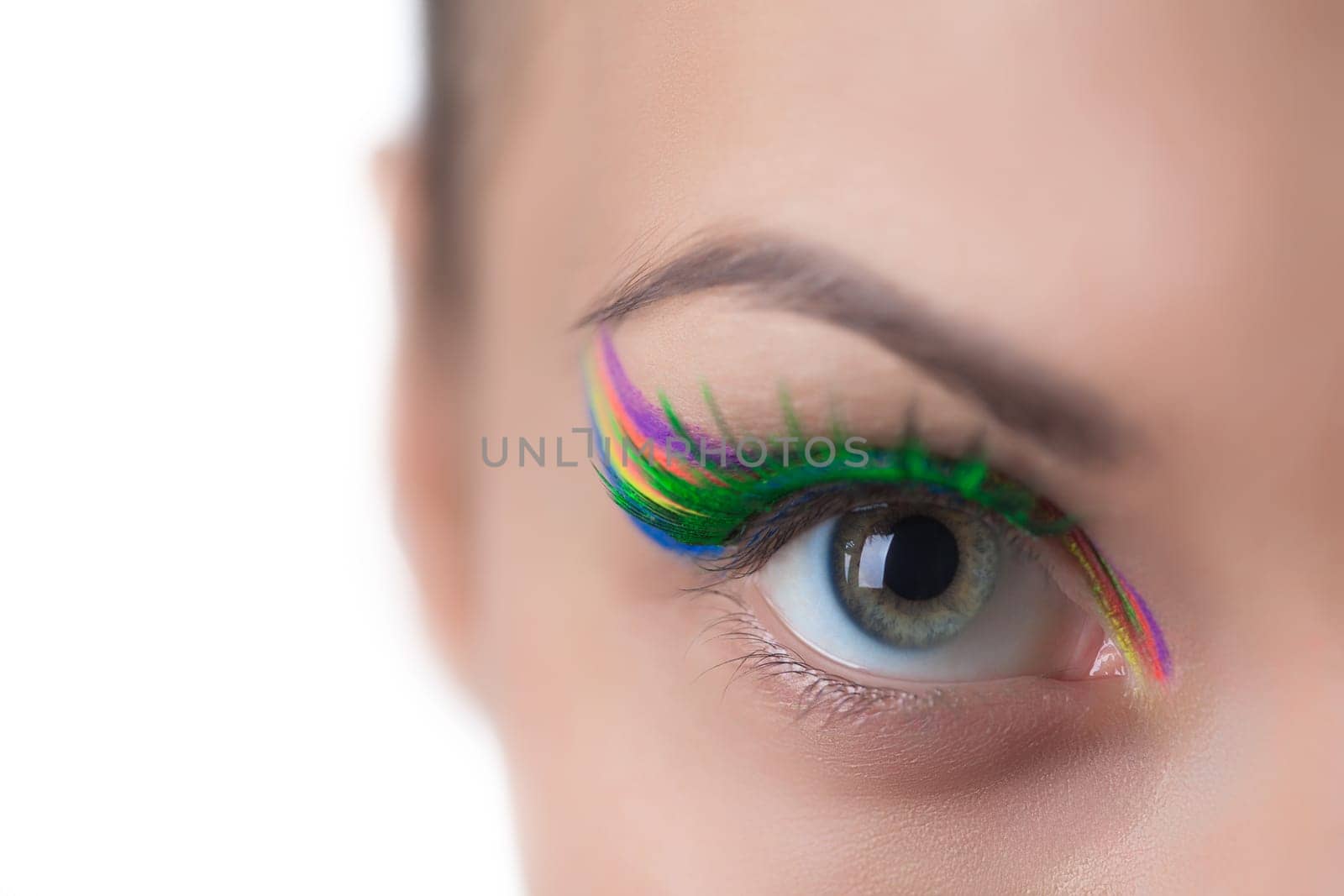 Gray-eyed girl with bright UV make-up, close-up
