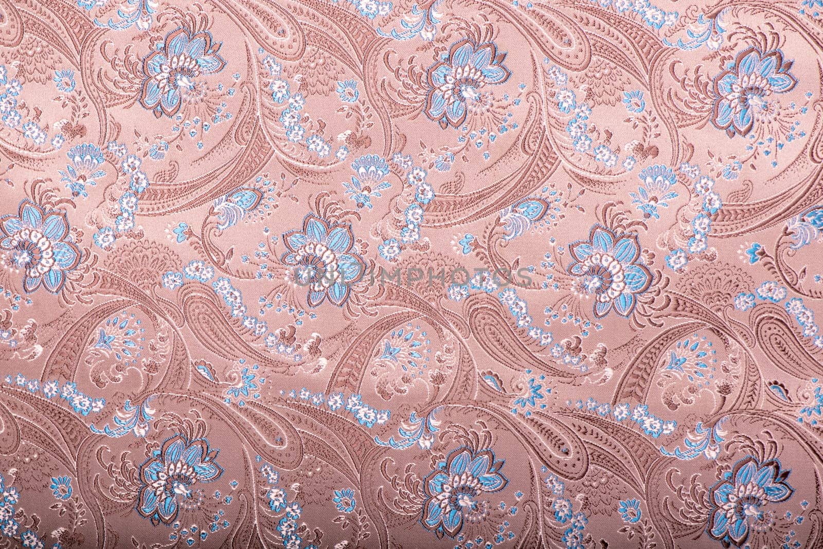 Beautiful pattern with ornament from embroidered blue flowers. Fashion design. mbroidered pattern background with ornamental flowers on pink background.
