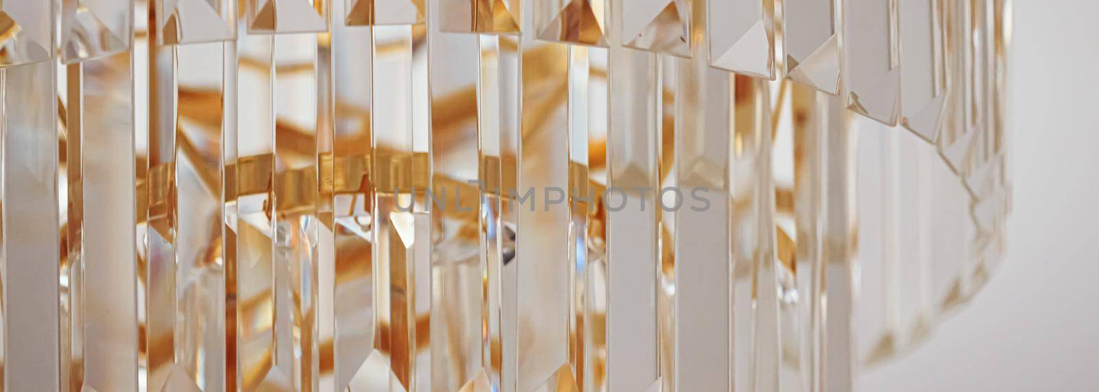 Crystal glass chandelier with golden details, luxury furniture and home decor concept