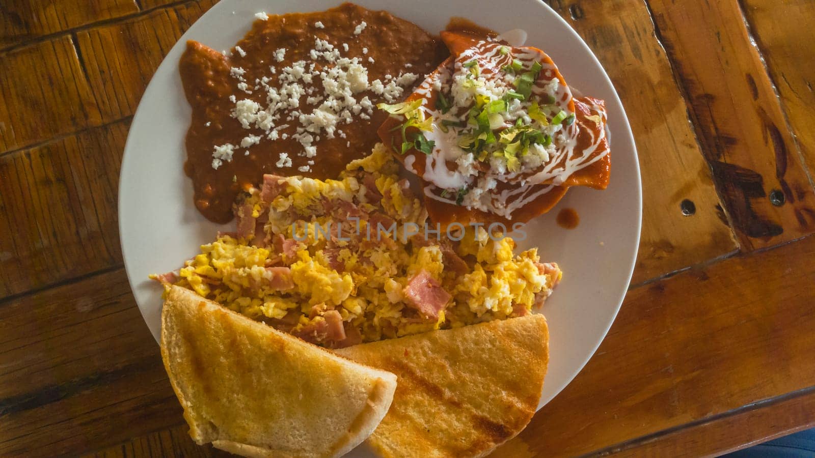 Chilaquiles and Refried Beans, Traditional Mexican Breakfast by RobertPB