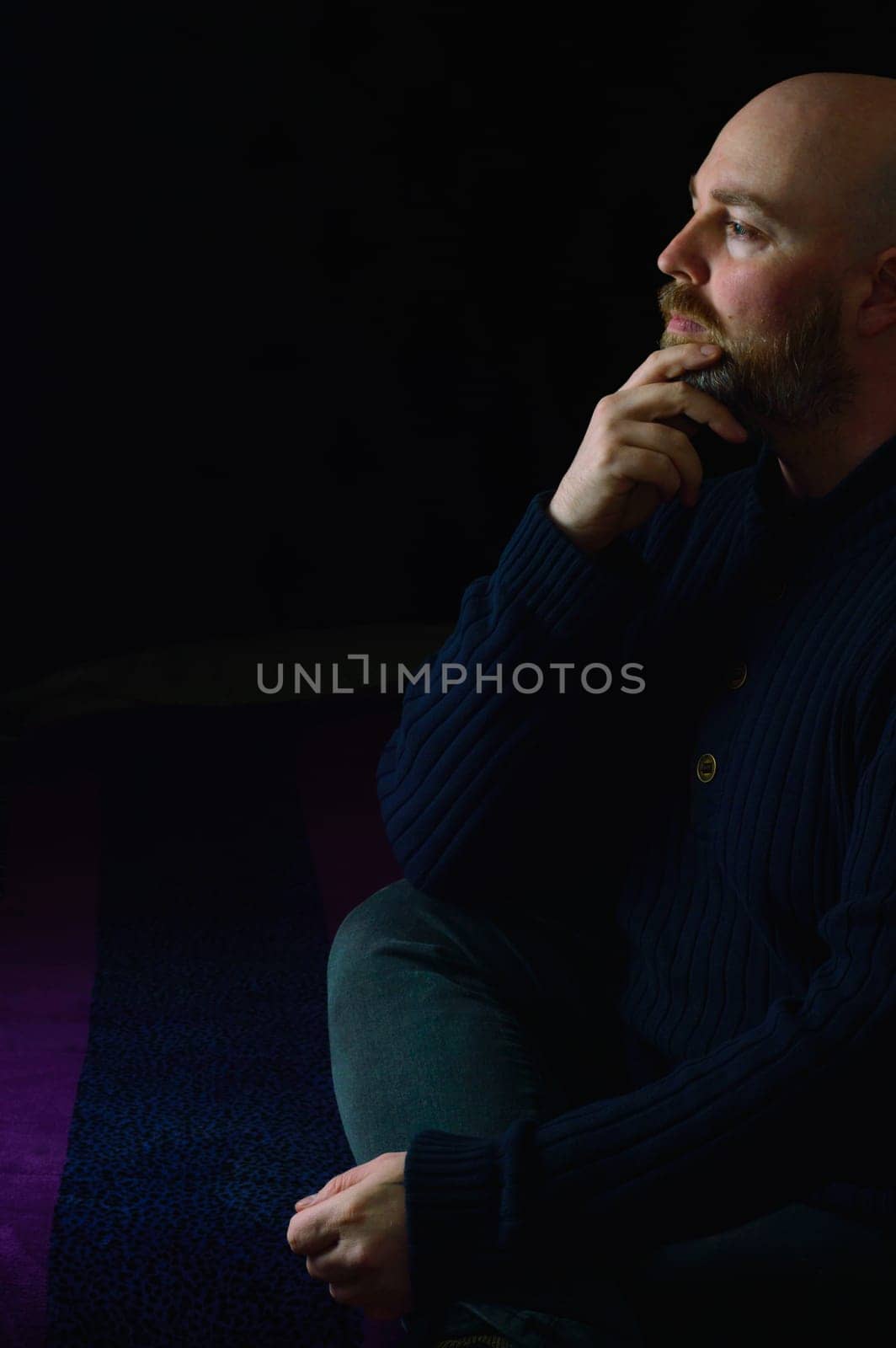 Caucasian Male on Dark Background in Thinking Pose Profile Shot by RobertPB