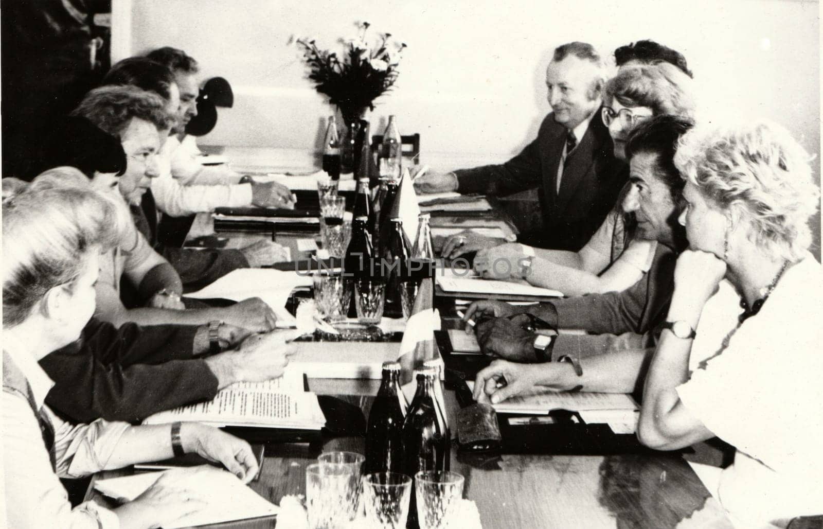 THE CZECHOSLOVAK SOCIALIST REPUBLIC - CIRCA 1980s: Vintage photo shows people during job meeting. Photography from communist era. Retro black and white photography. Circa 1980.