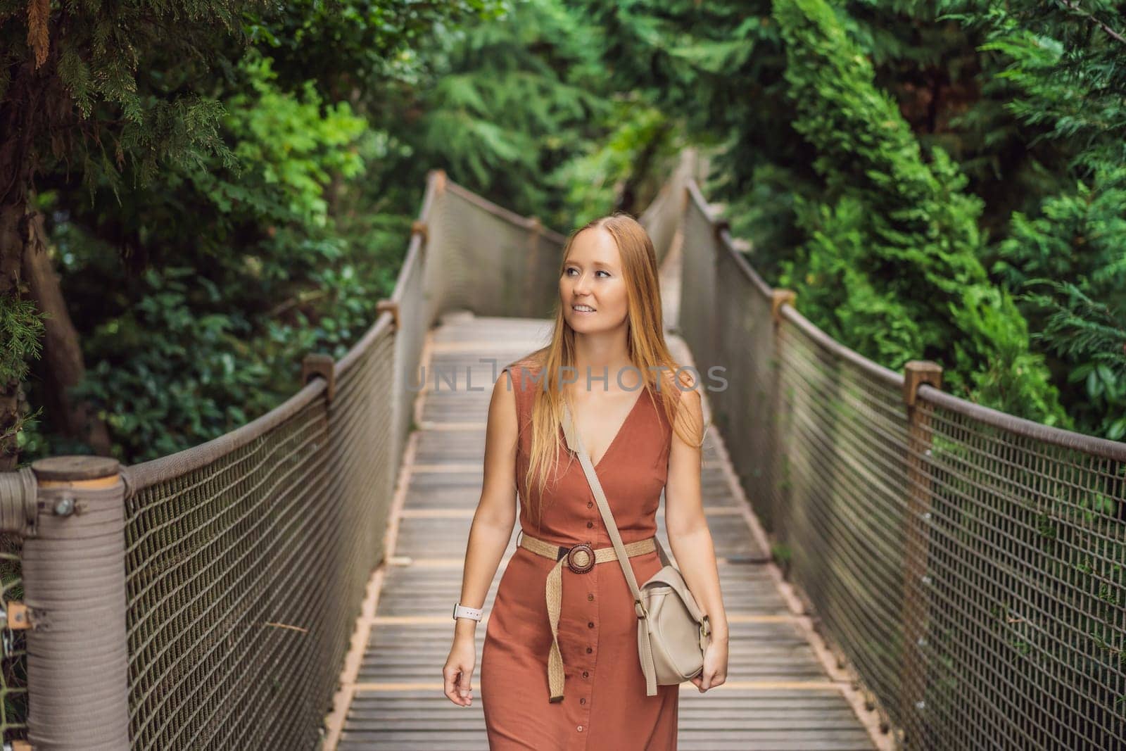 Woman tourist in Rope bridge in Yildiz Park. Besiktas, Istanbul, Turkey. Turkiye.