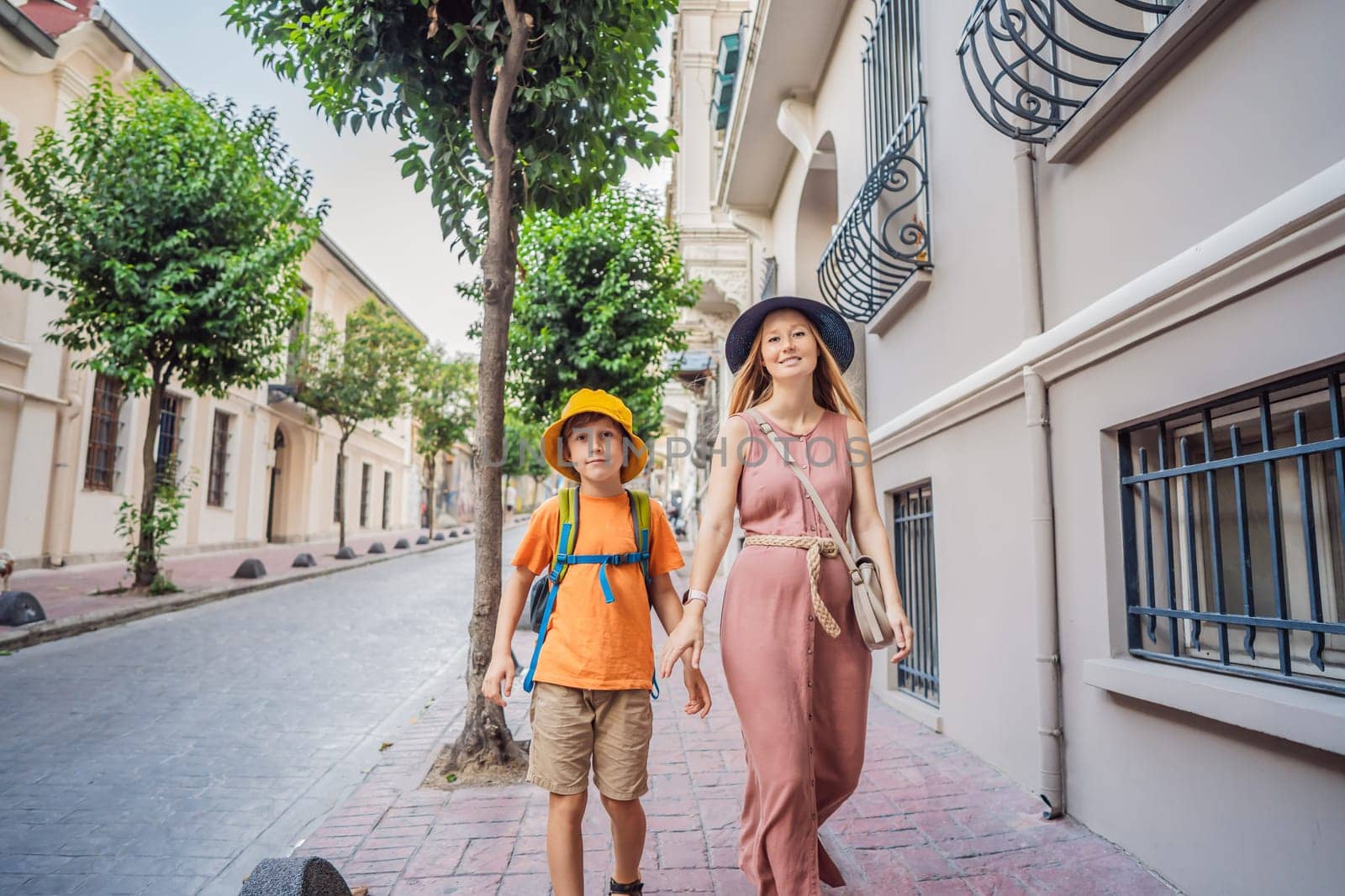 Mother and son tourists walk through the old streets of Istanbul. Travel to istanbul concept. Traveling with kids concept.