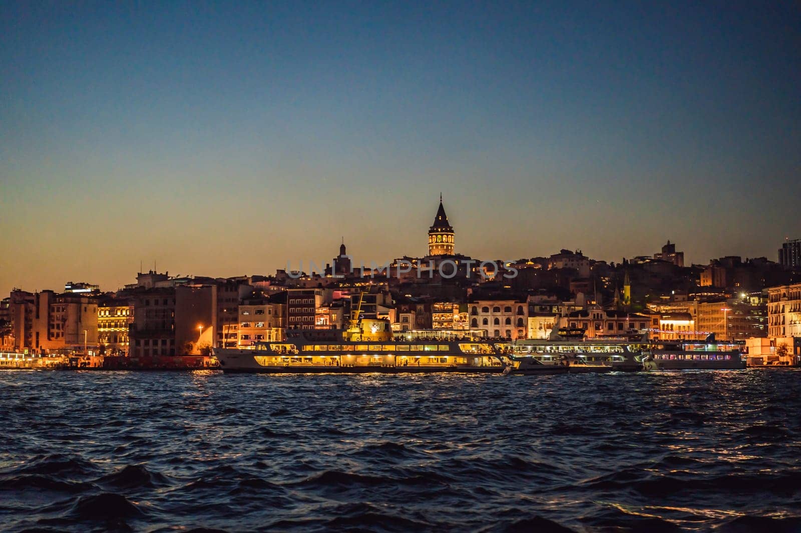 Istanbul city skyline in Turkey, Beyoglu district old houses with Galata tower on top, view from the Golden Horn.