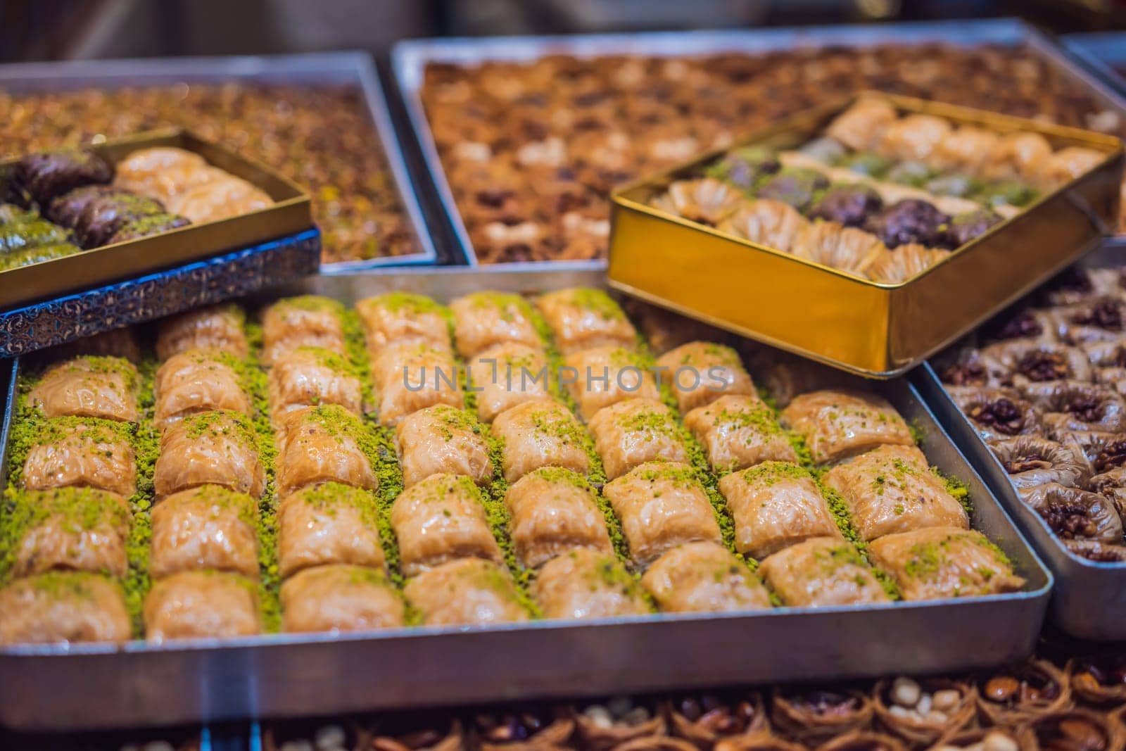 Traditional oriental sweet pastry cookies, nuts, dried fruits, pastilles, marmalade, Turkish desert with sugar, honey and pistachio, in display at a street food market by galitskaya