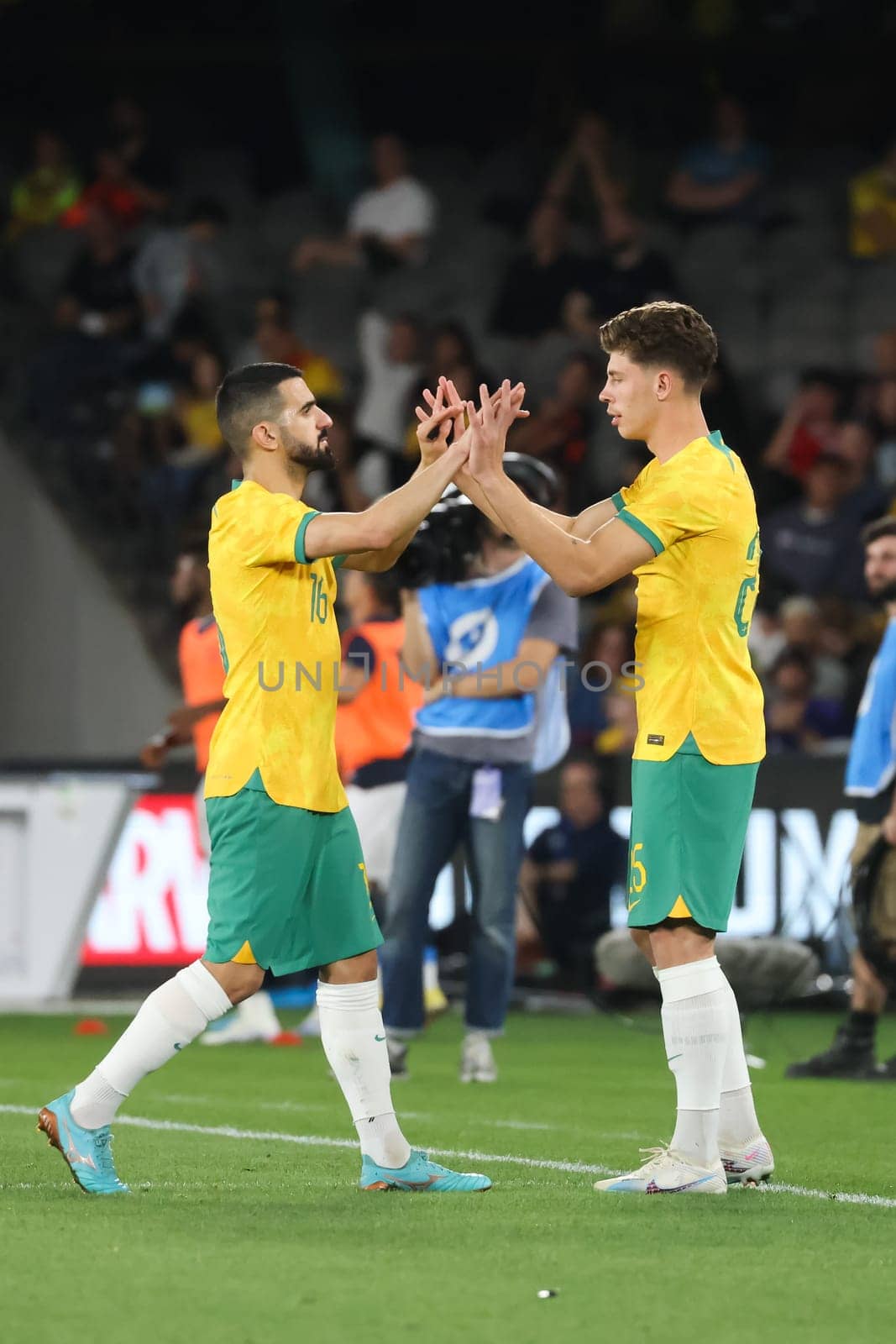 MELBOURNE, AUSTRALIA - MARCH 28: Jordan Bos of Australia subs with Aziz Behich during an international friendly match between the Australia Socceroos and Ecuador at Marvel Stadium on March 28, 2023 in Melbourne, Australia.