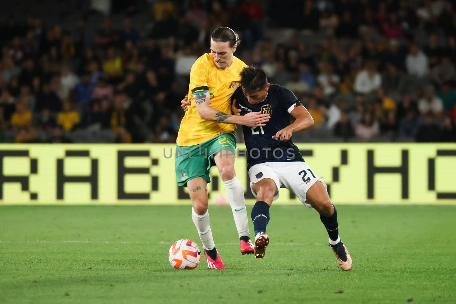 MELBOURNE, AUSTRALIA - MARCH 28: Jackson Irvine of Australia battles with Alan Franco of Ecuador during an international friendly match between the Australia Socceroos and Ecuador at Marvel Stadium on March 28, 2023 in Melbourne, Australia.