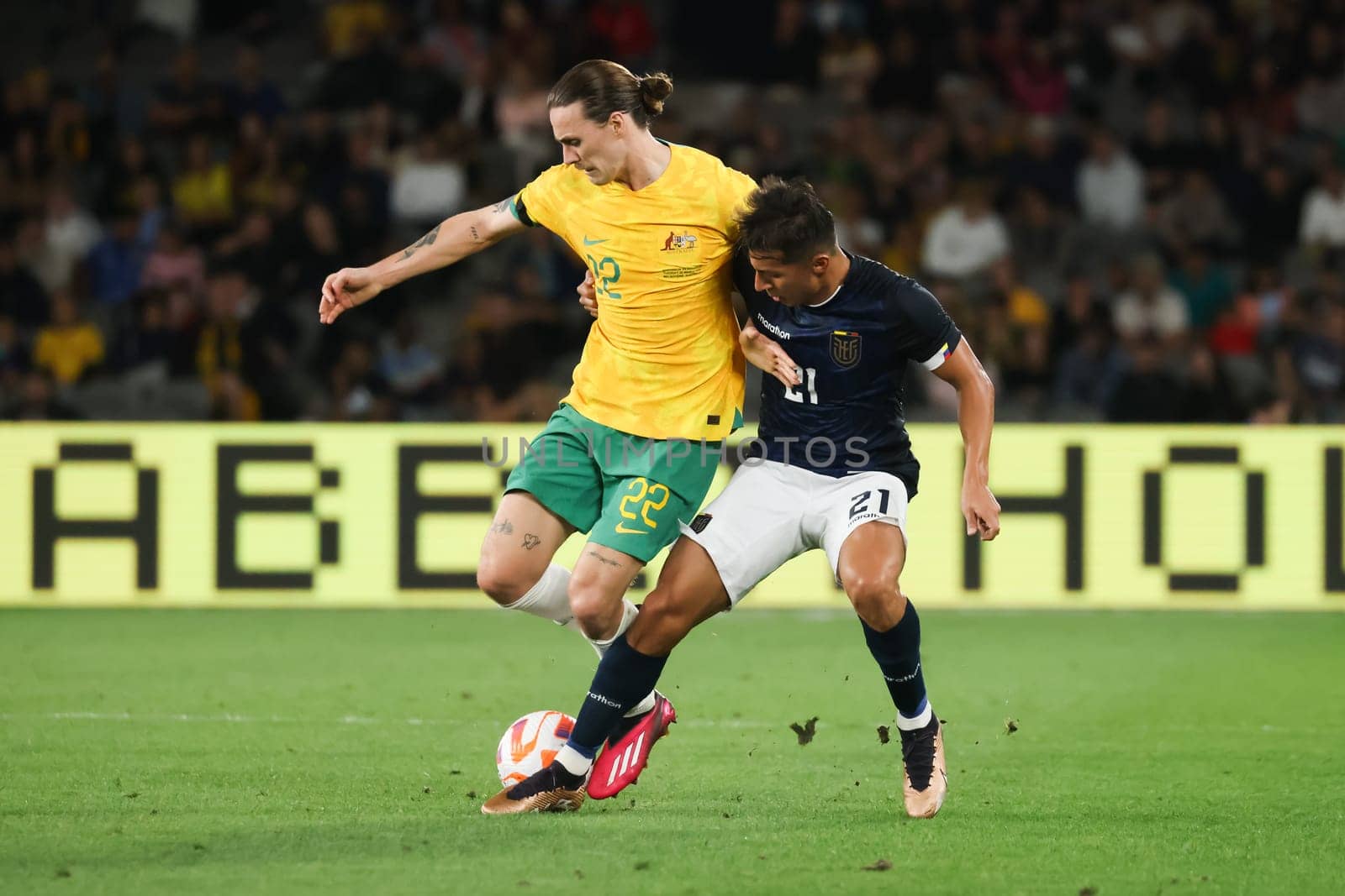 MELBOURNE, AUSTRALIA - MARCH 28: Jackson Irvine of Australia battles with Alan Franco of Ecuador during an international friendly match between the Australia Socceroos and Ecuador at Marvel Stadium on March 28, 2023 in Melbourne, Australia.